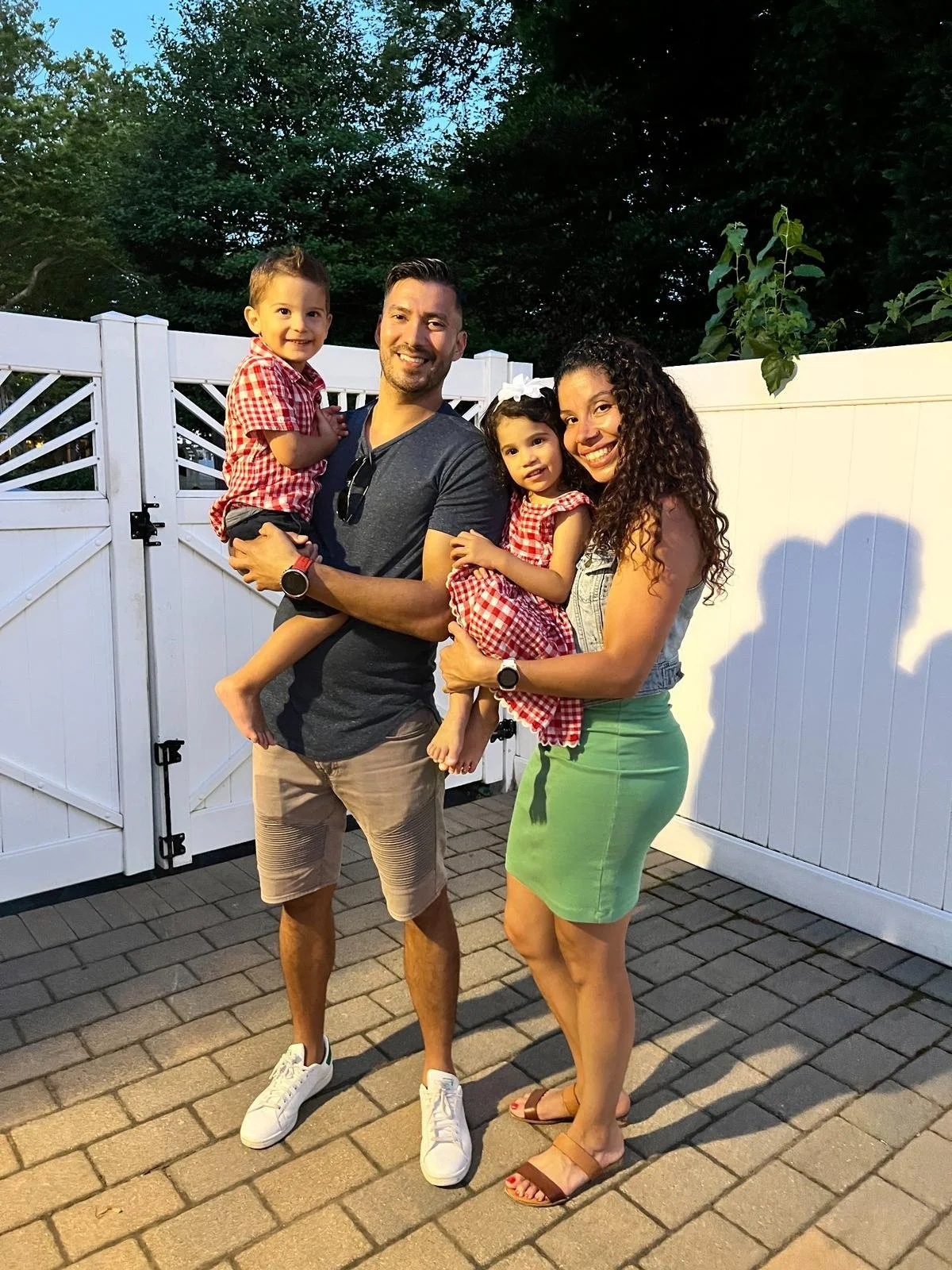 Barbi with her partner and twin children, representing family, balance, and real life behind her wellness journey.