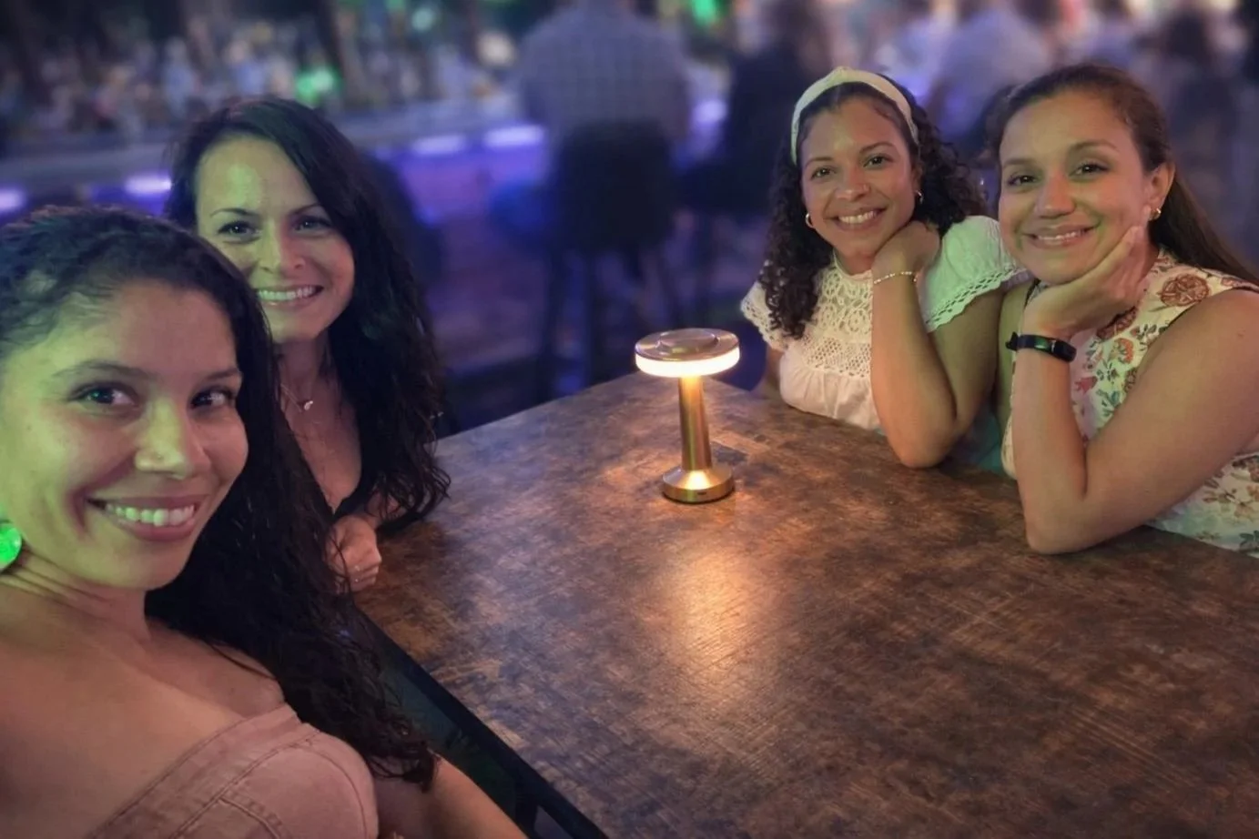 Barbara Vega celebrating her birthday with her chosen family, reflecting sisterhood, resilience, and supportive community showing up.