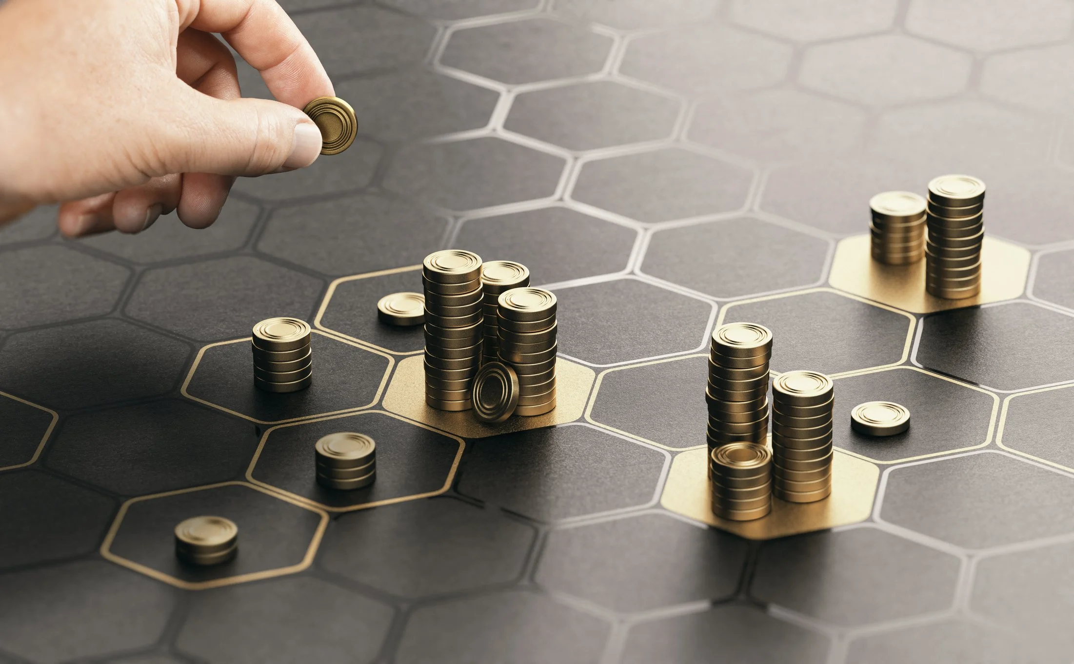 A hand placing gold coins on a hexagonal-tile game board with other stacks of coins and gold-highlighted hexagons.