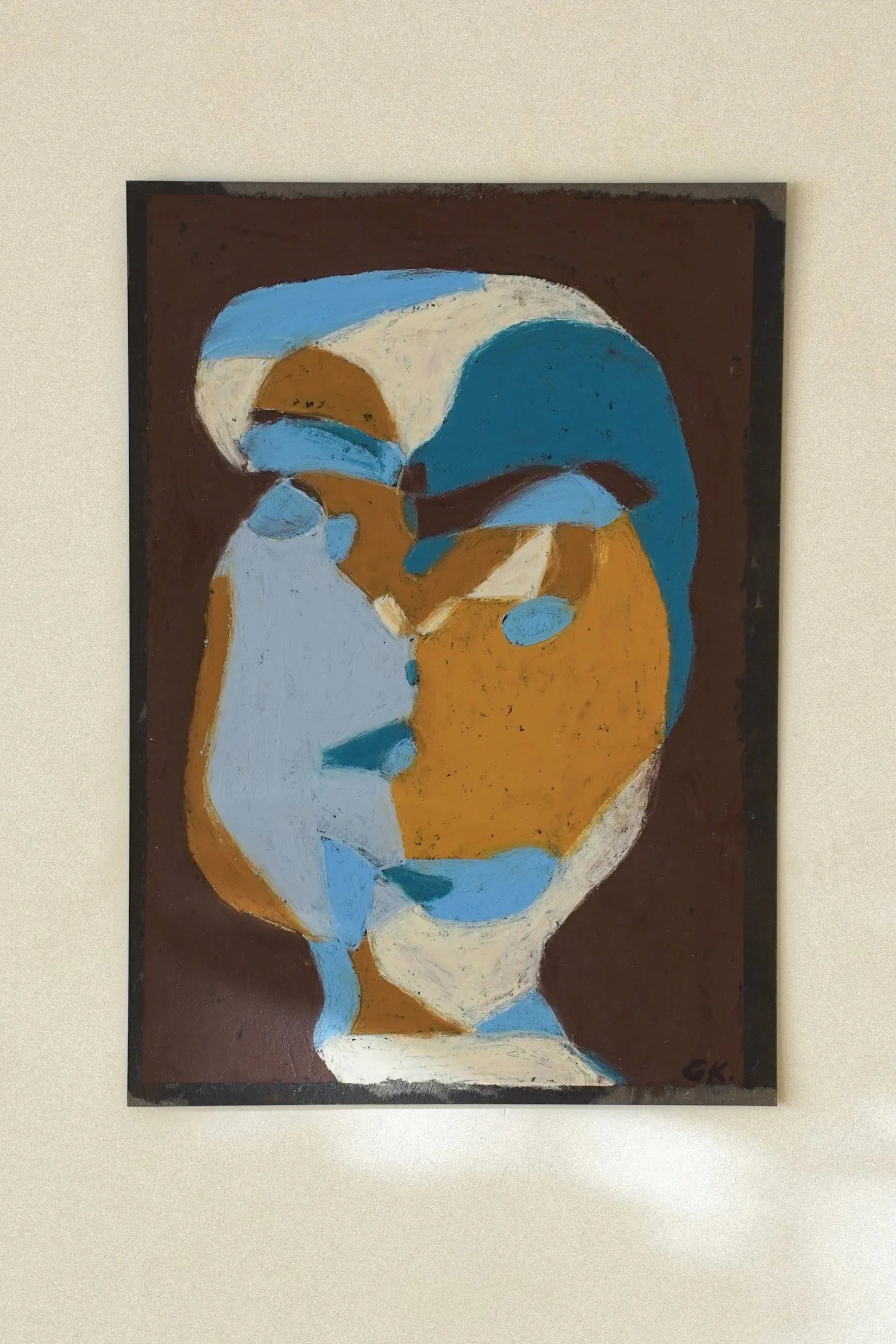 Abstract painting of a face using blue, brown, white, and beige colors.