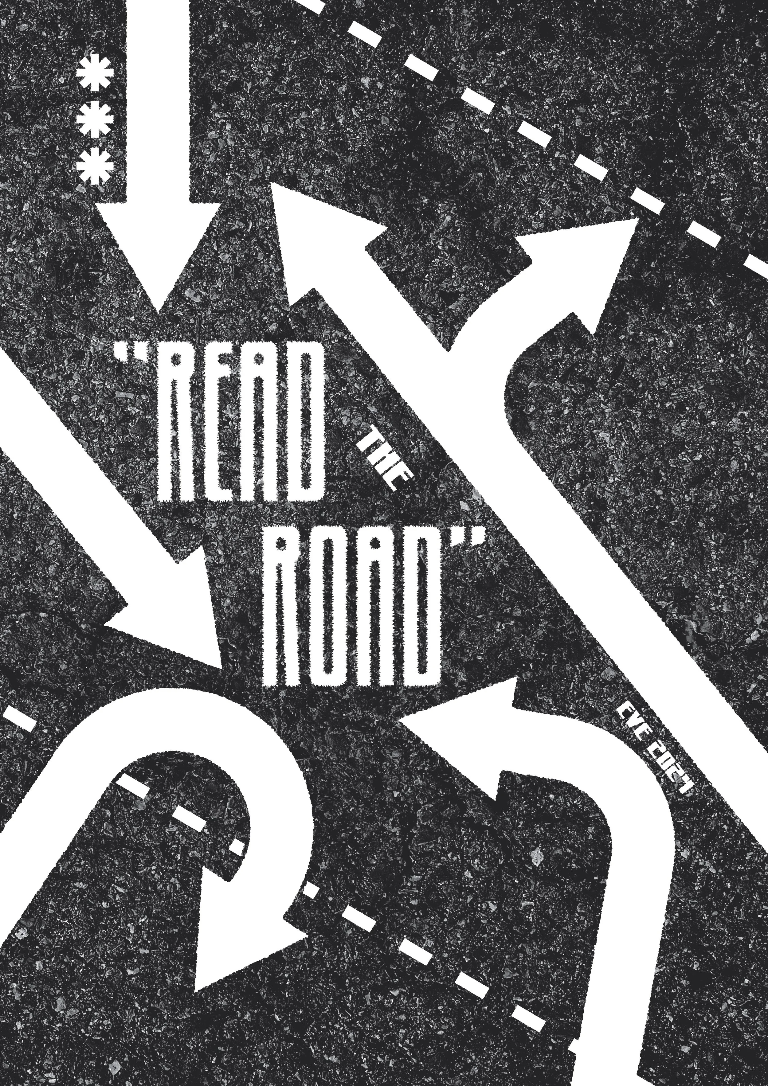 Black asphalt surface with white painted directional arrows and text saying "Read the Road" and "Observe."