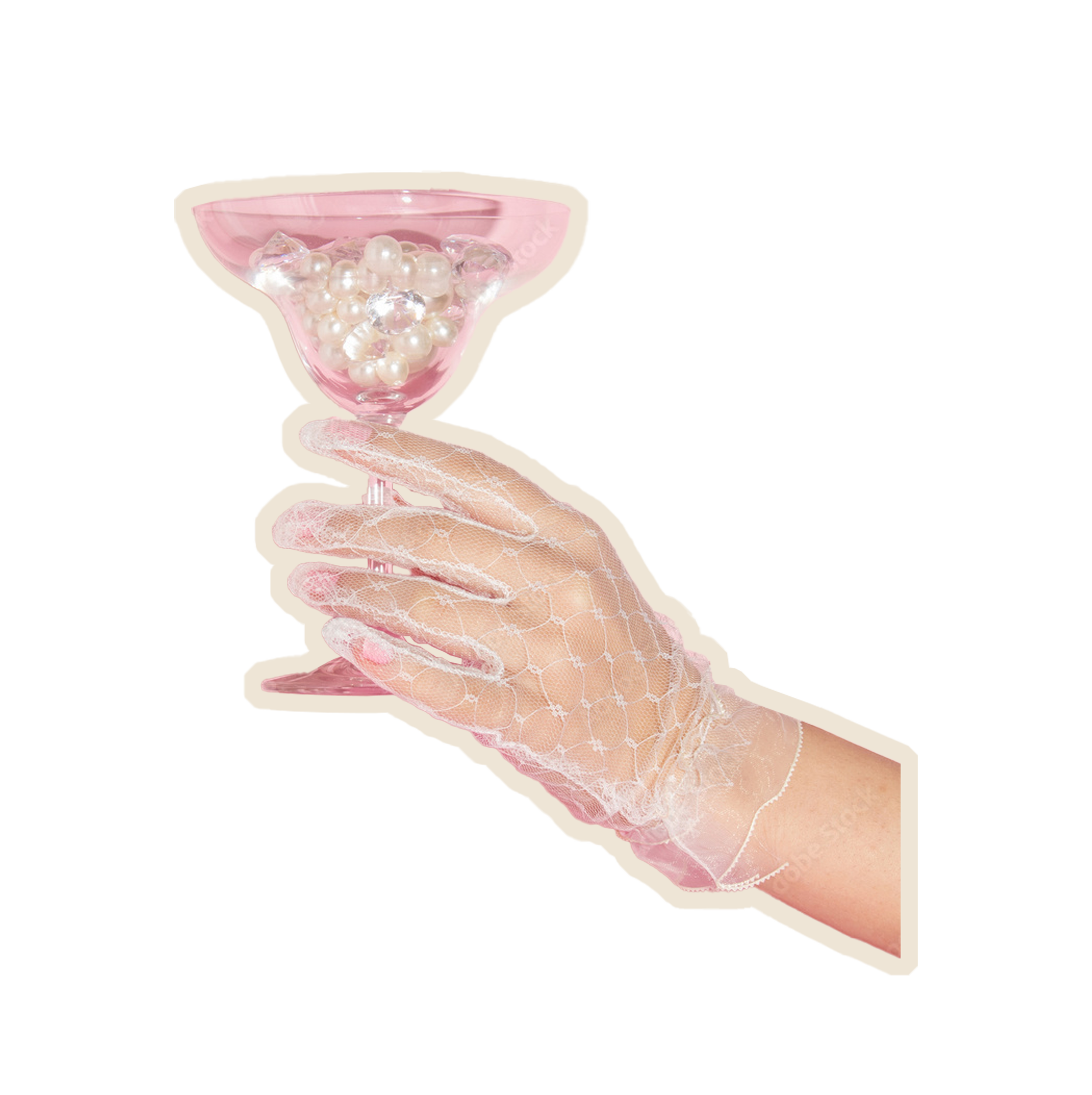 A delicate hand in a sheer, white lace glove holding a pink champagne glass filled with pearls and clear gemstones.