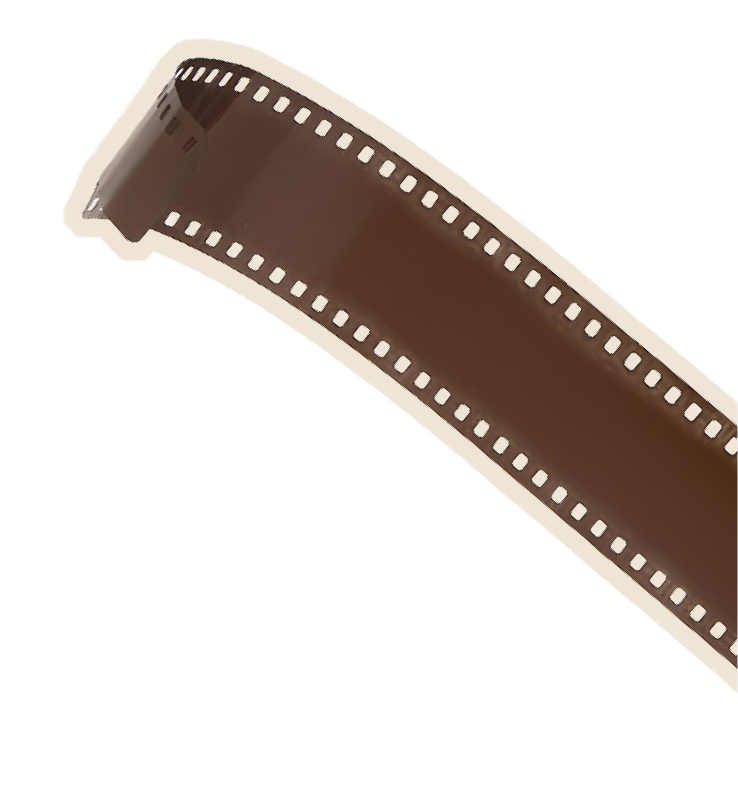 Close-up of a strip of 35mm photographic film with brownish frames and perforations along the edges.