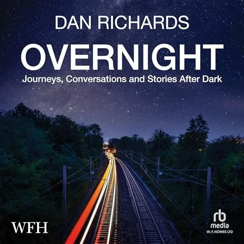 Audiobook cover titled 'Overnight: Journeys, Conversations and Stories After Dark' by Dan Richards, published in 2025. The background features a night scene with a starry sky and train tracks, with light trails from moving trains.