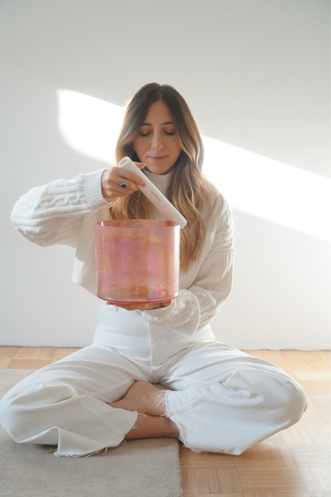 Nicole Rutsch playing Crystal Tones Alchemy pink singing bowl sound healing NYC