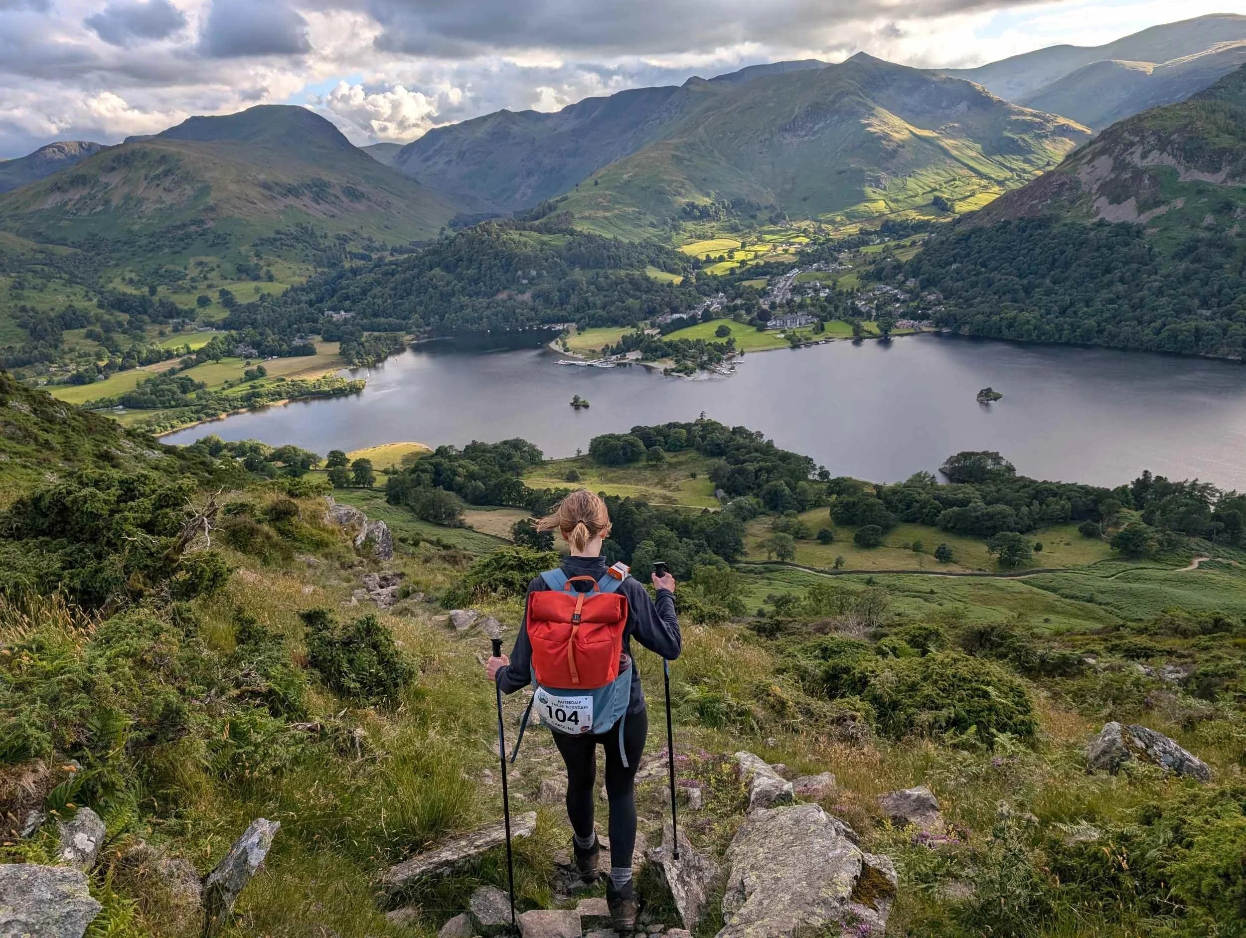 Walker overlooking Ullswater from the fellside