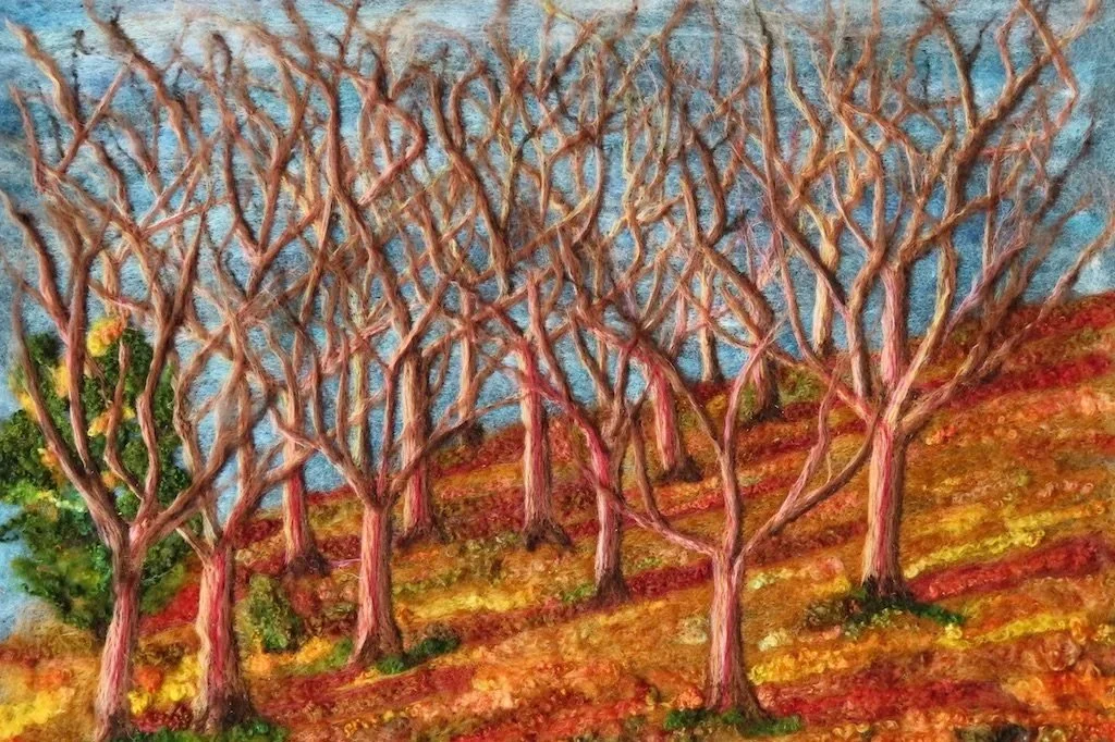 Needle and felt artwork by Jane Firth of winter trees at Dunmallard Hill