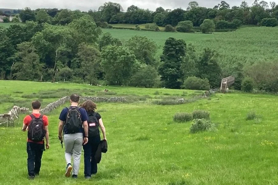 Photograph by Cecilia McCabe of three people on the Eamont Way approaching Stockbridge