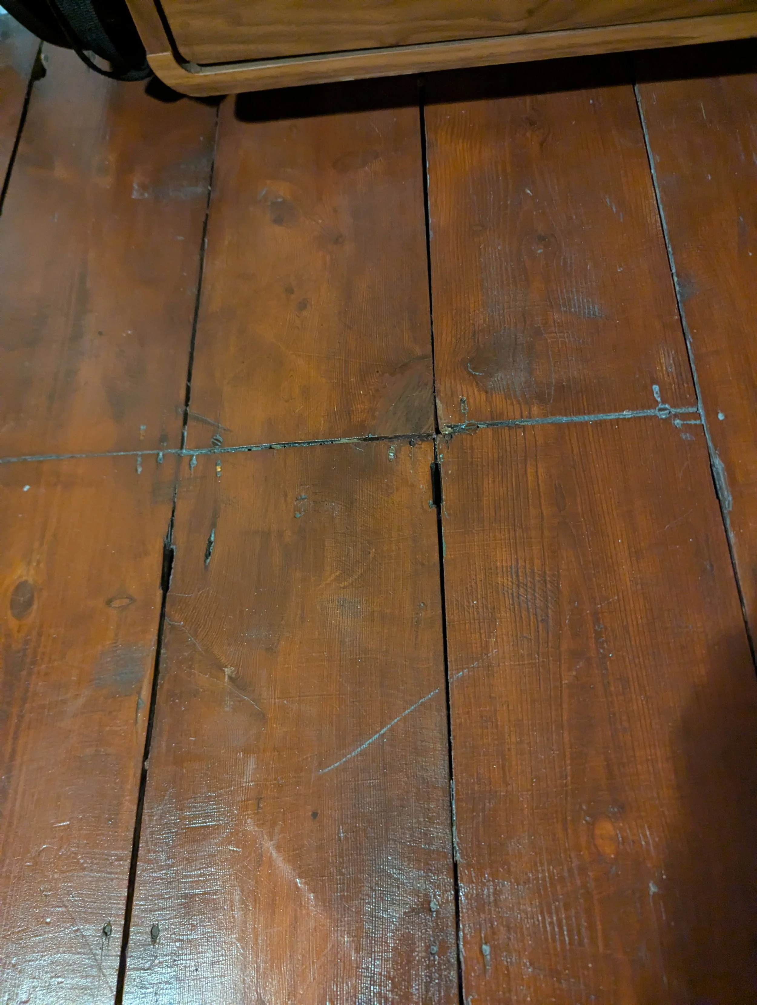 An after photo showing a completed flooring repair job on a chipped Georgian floorboard