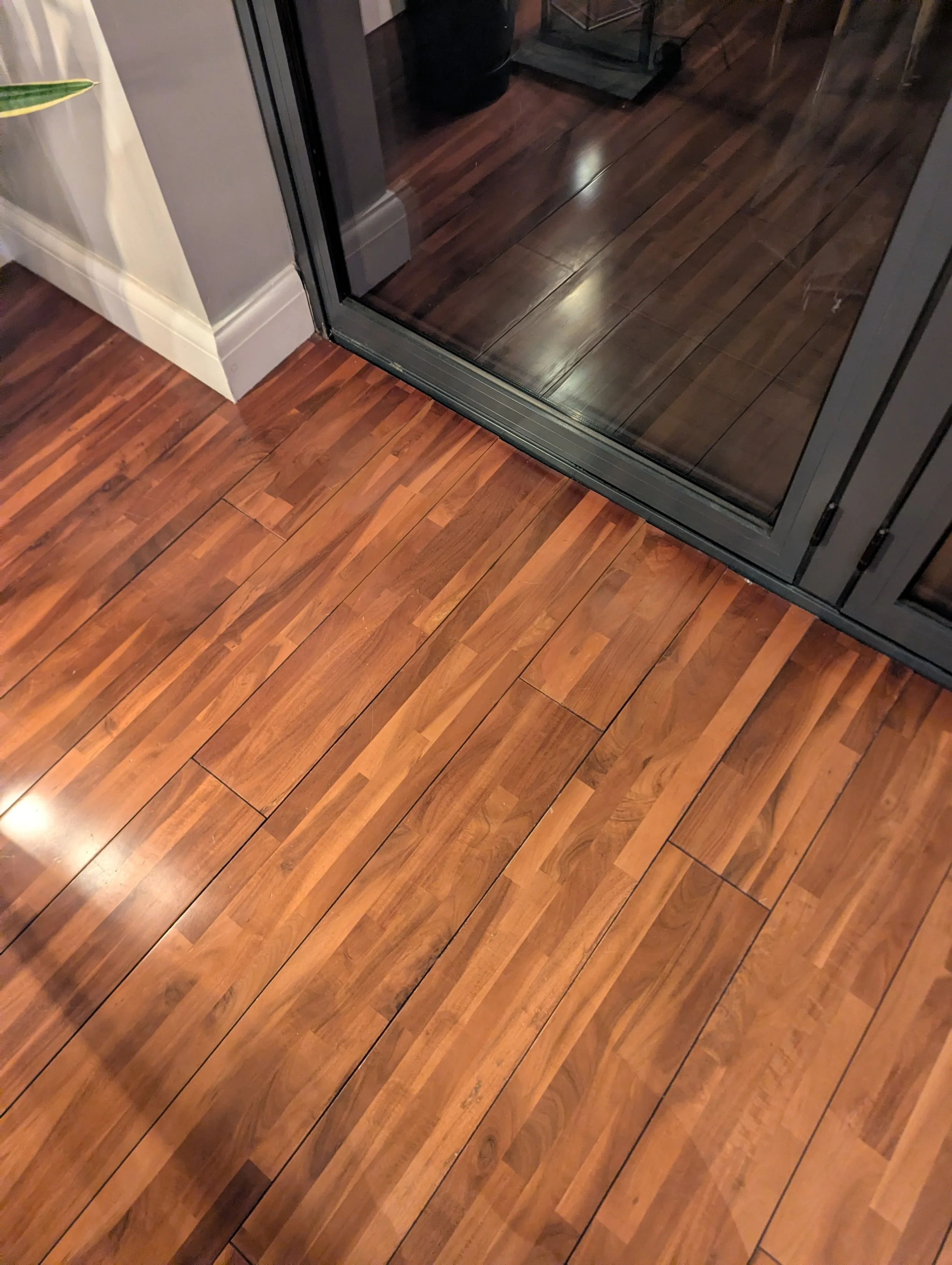 Image shows a professionally repaired floor. Painted floor. Water damaged floor repair