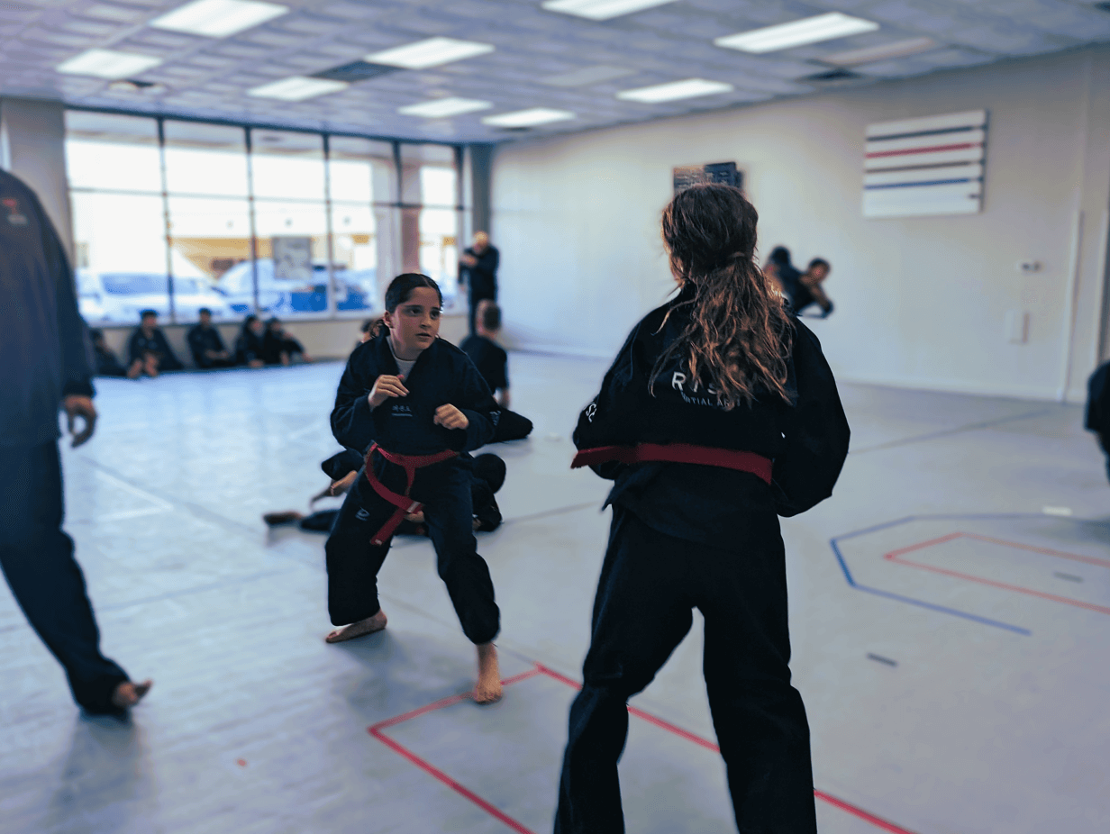 Girls getting ready to train in martial arts.png