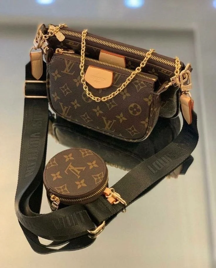 A Louis Vuitton handbag with a gold chain strap, a detachable black strap, and a matching round coin purse, all featuring the brand's signature monogram pattern.