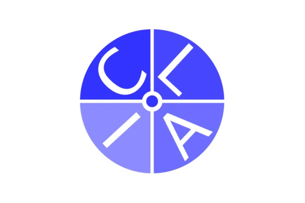 A circular logo divided into four sections with the word 'CLOCK' spelled out, each letter in a different section, with a blue gradient background.