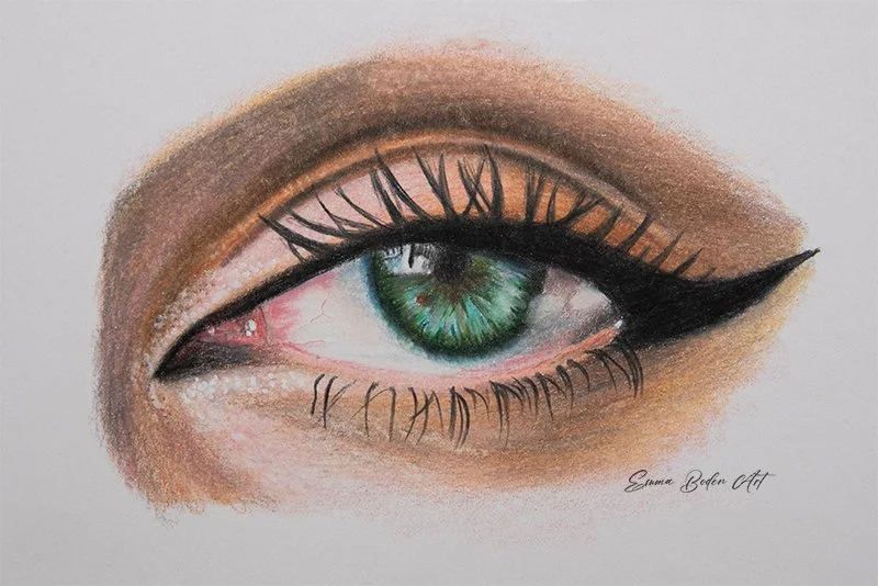 beautiful ladies green eye drawn in coloured pencils