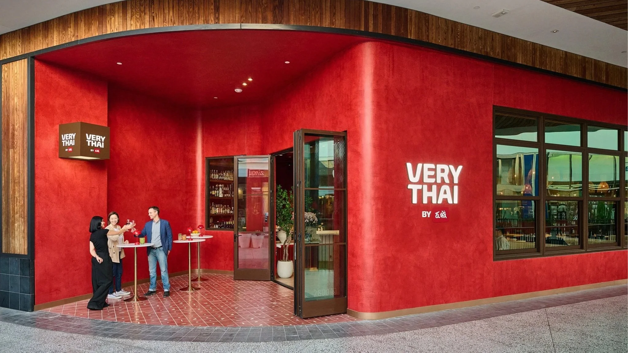 Exterior entrance of Very Thai restaurant with bold red architectural design, creating a striking and modern visual identity in LA Very Thai Westfield Century City..