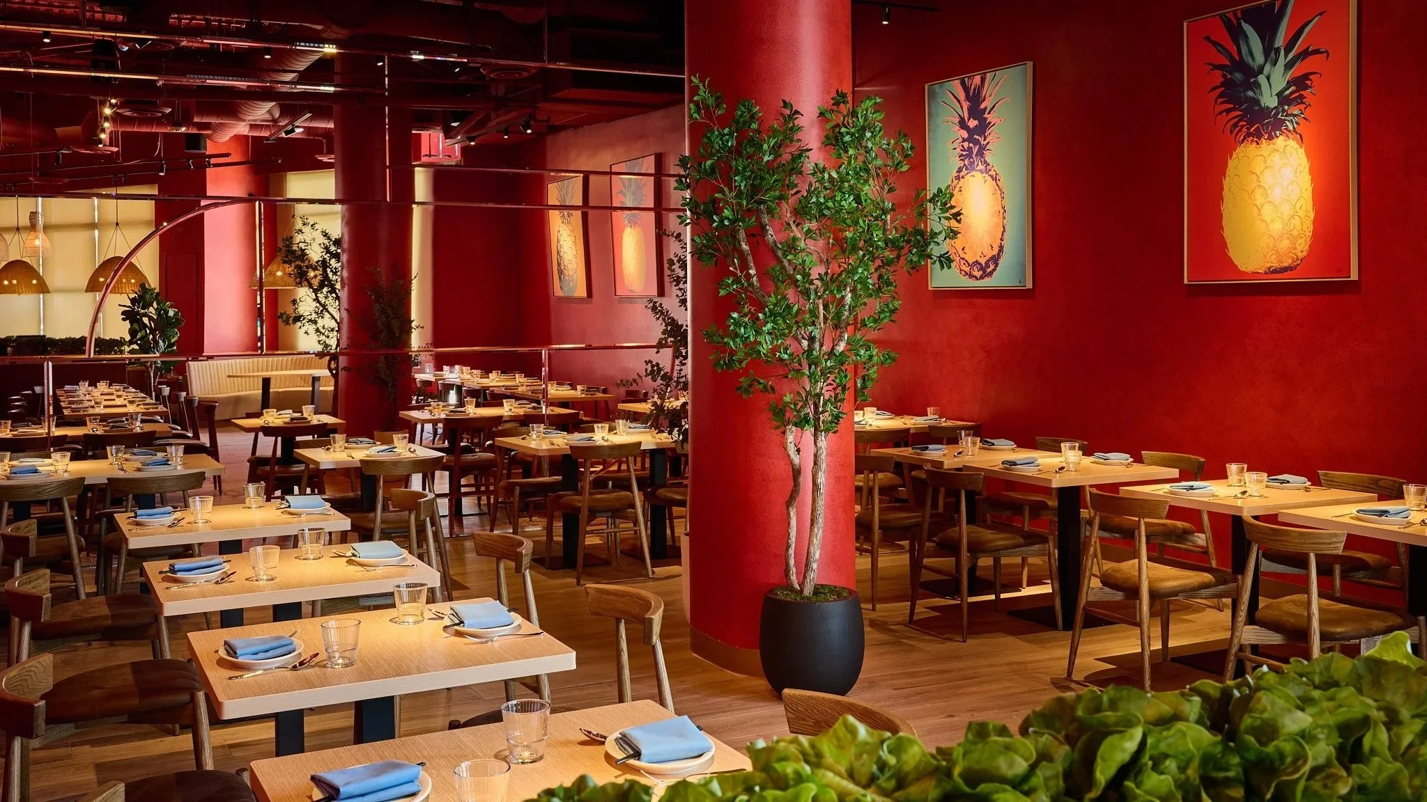 Warm and vibrant Thai restaurant interior with red tones and ambient lighting, creating an inviting dining atmosphere in LA Very Thai Westfield Century City..
