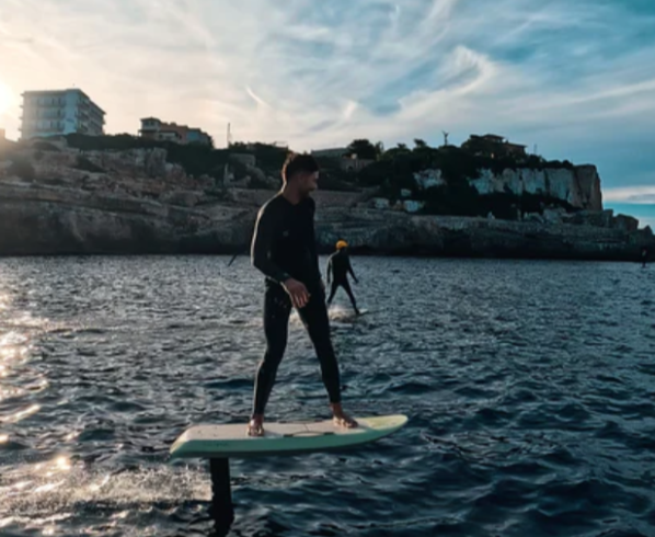 Man on water toy at sea