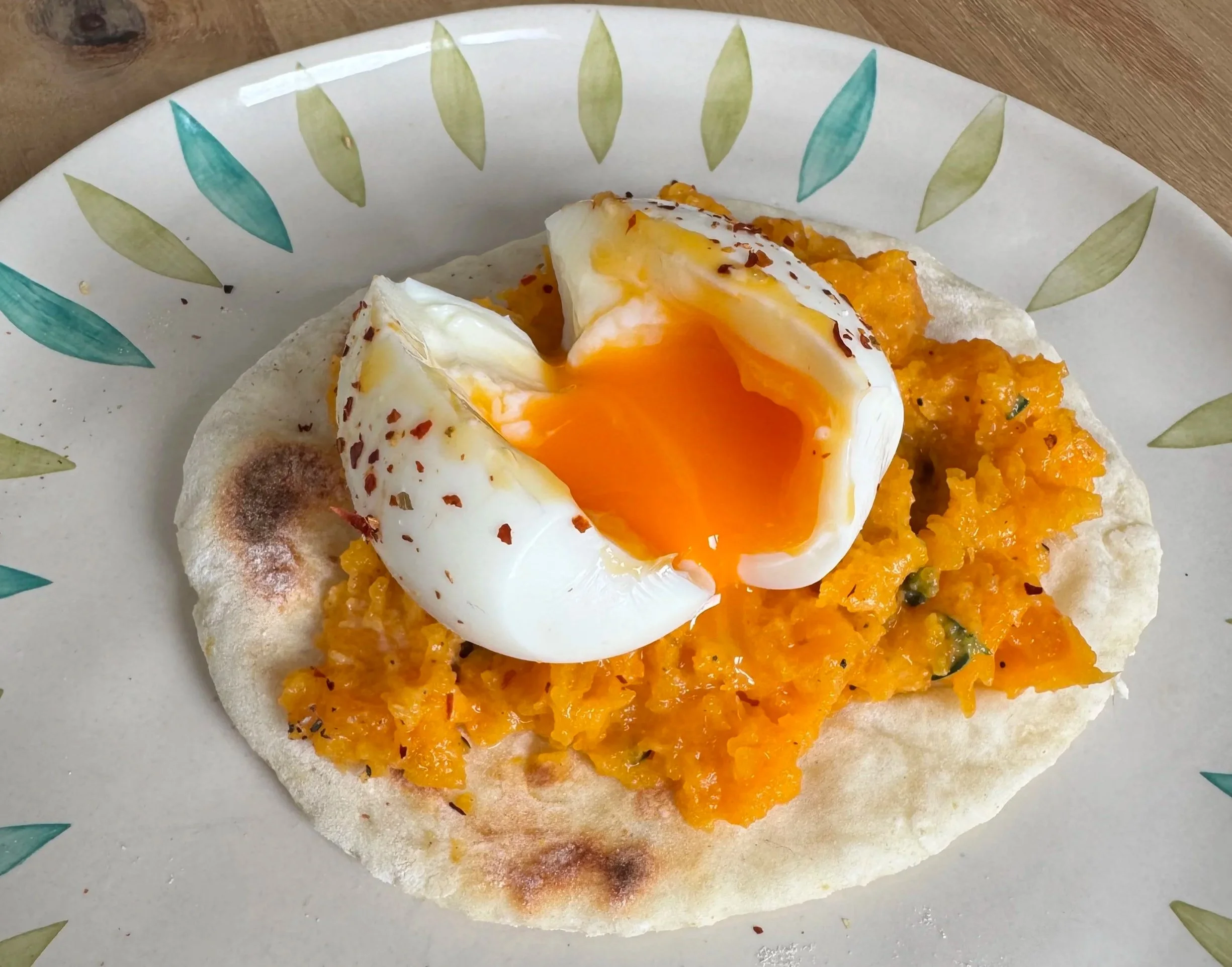 Mashed butternut squash and eggs on flatbread