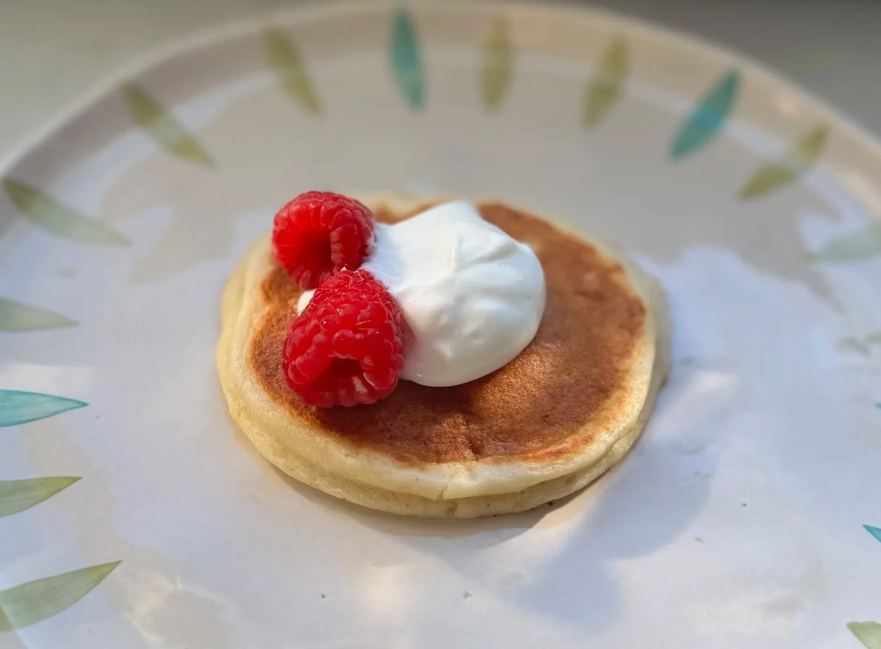 Fluffy lemon ricotta pancakes with a lemony maple syrup drizzle