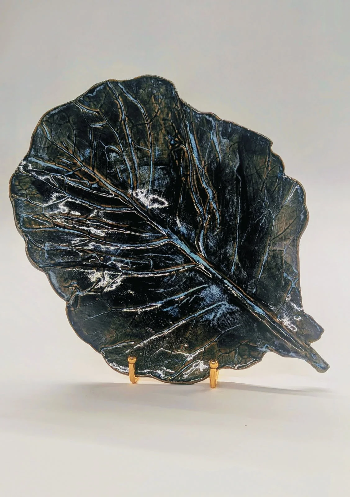 "Collard Leaf Plates" (close-up), 2025, hand-built clay impressed with collard leaf, 13 x 9.75 x 1.5 in. approx.