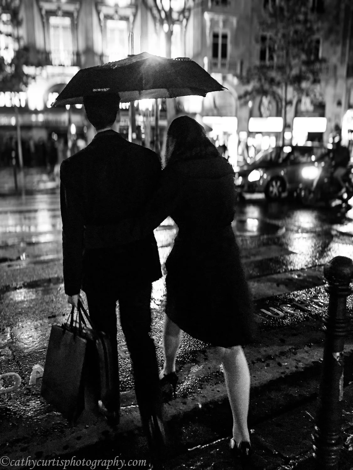 Couple rainy night umbrella.jpg