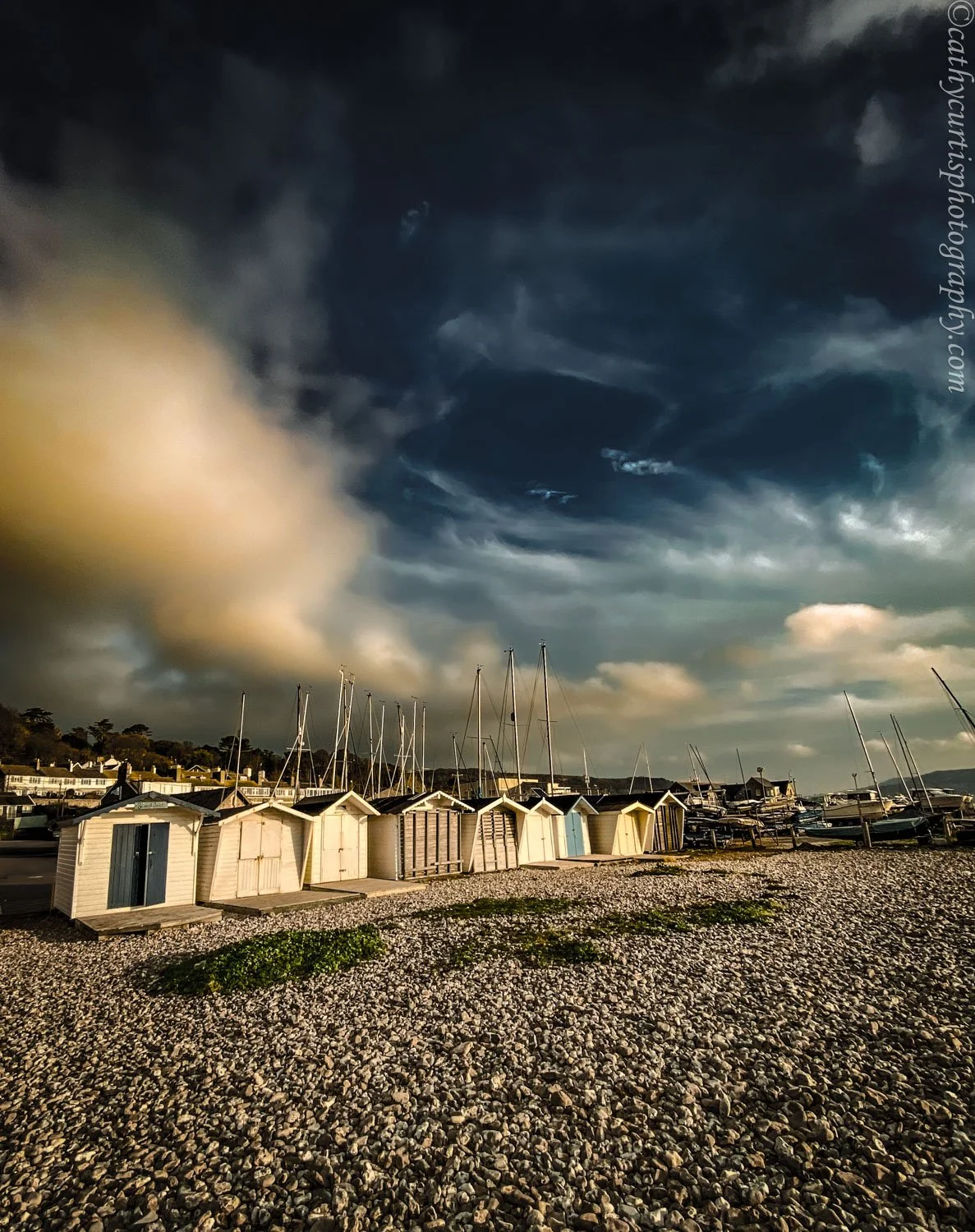 Beach huts swirl clouds.jpg