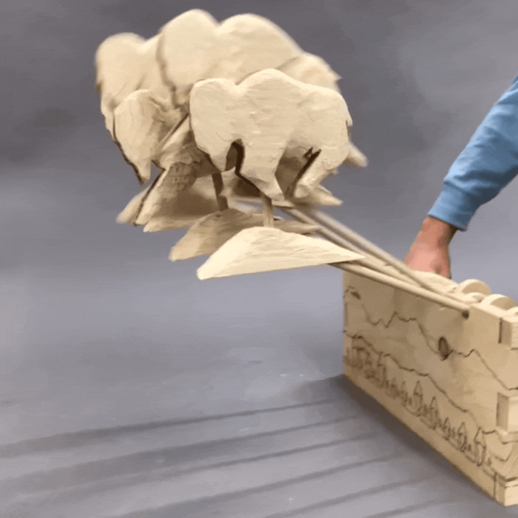 wood-kinetic-sculpture-buffalo-stampede.gif