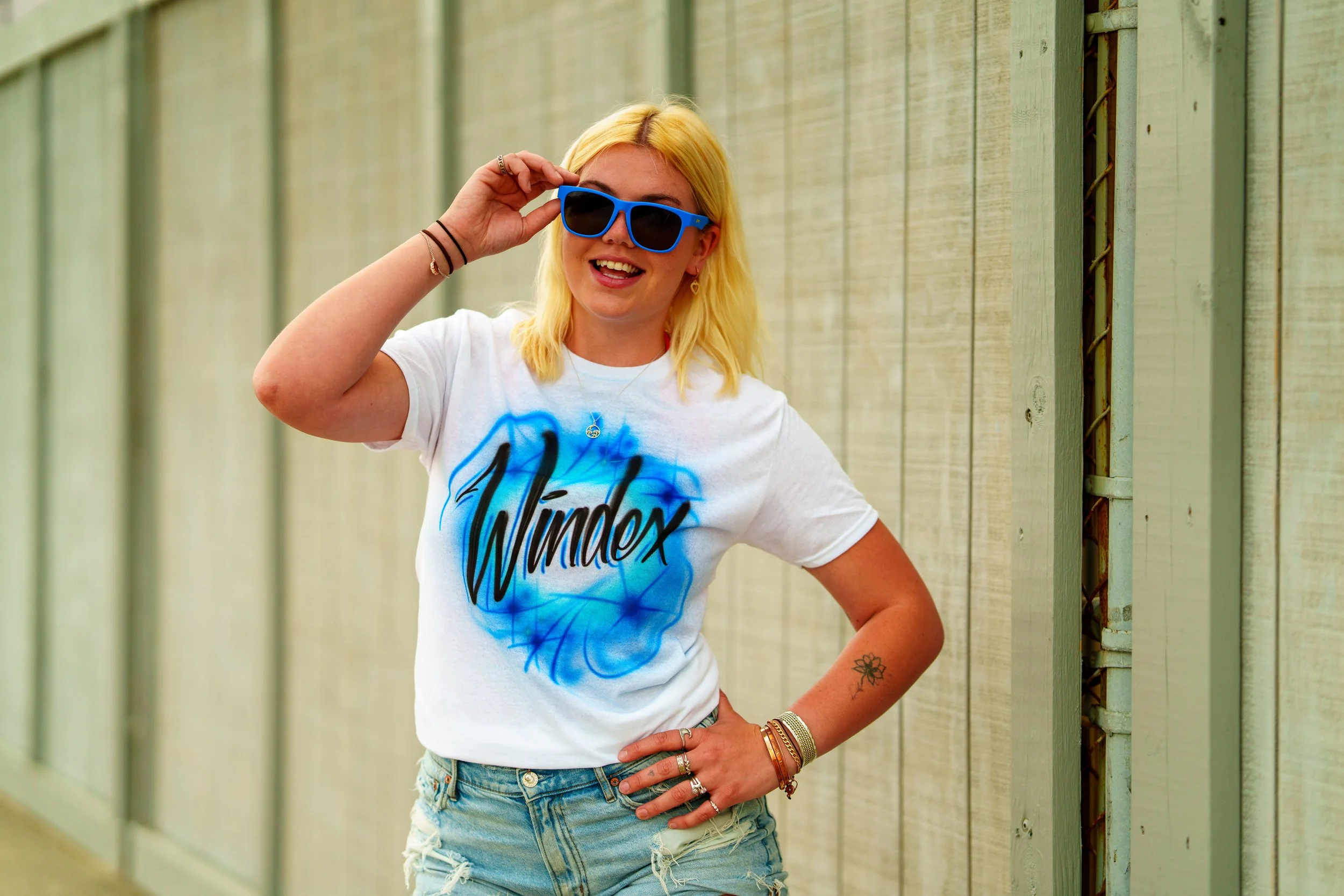 OOB Custom airbrush design in a blue background and black script text