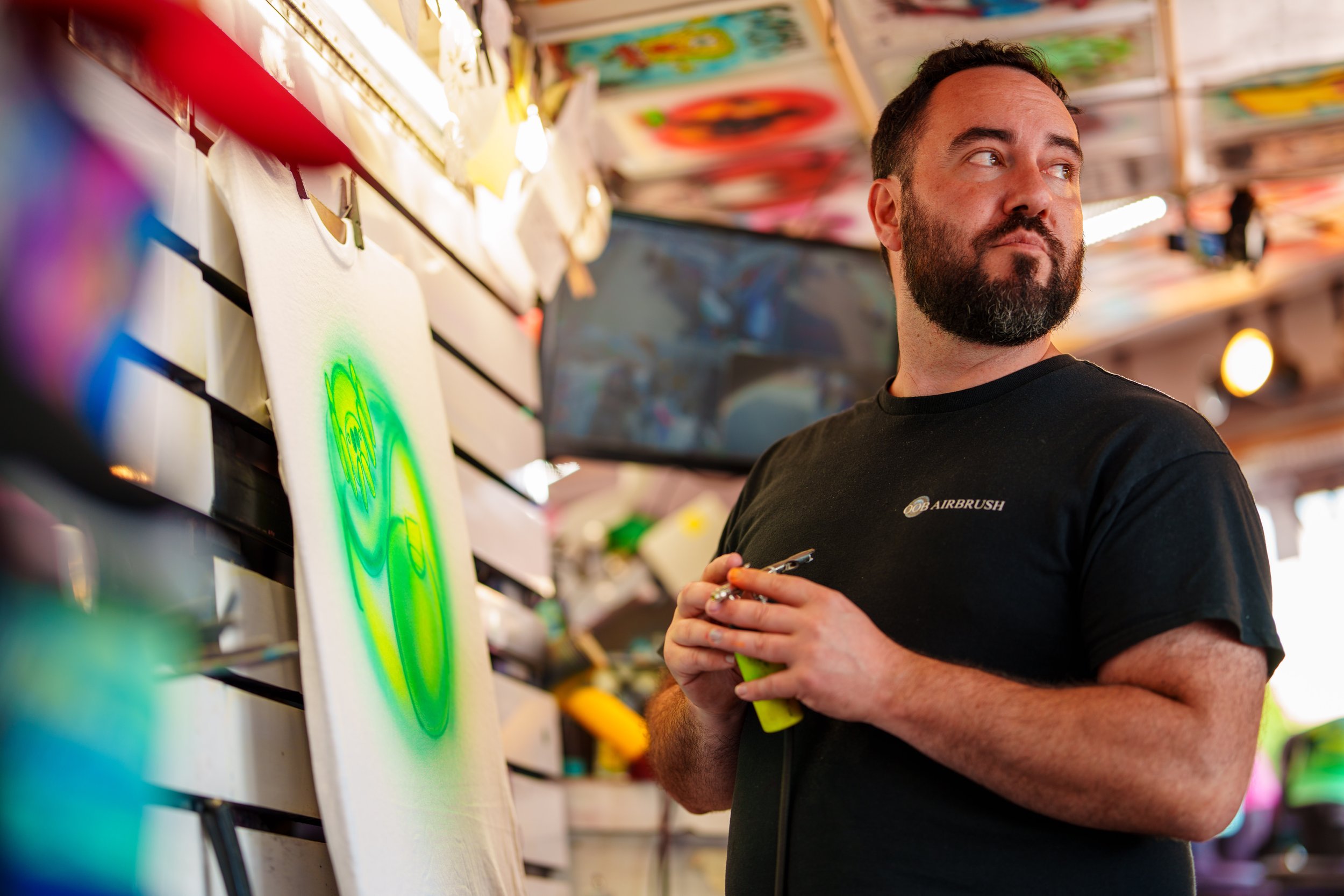 Old Orchard Beach Airbrush owner, custom paints airbrush t-shirts and apparel next to the beach in Maine.