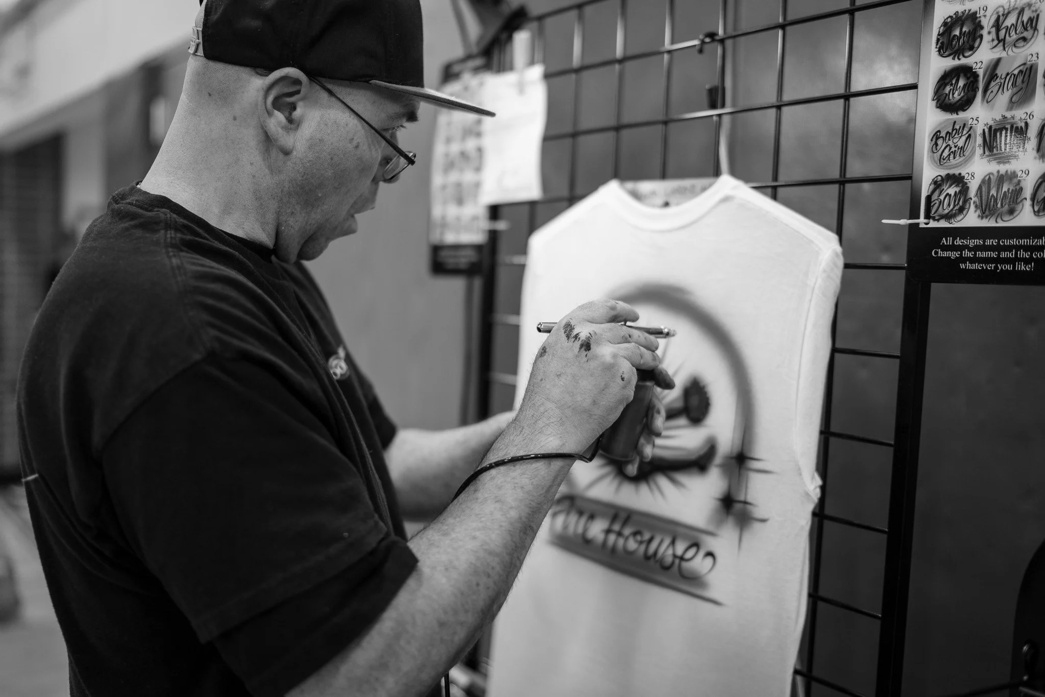 Old orchard beach airbrush painting t-shirts during a cheerleading competition