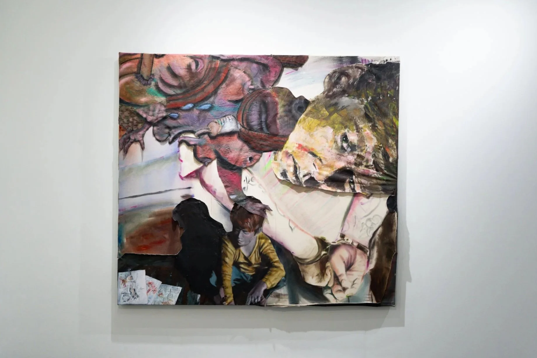 Mixed media artwork on canvas depicting a collage of a woman's face, two children, and abstract shapes with vibrant colors, mounted on a white gallery wall.