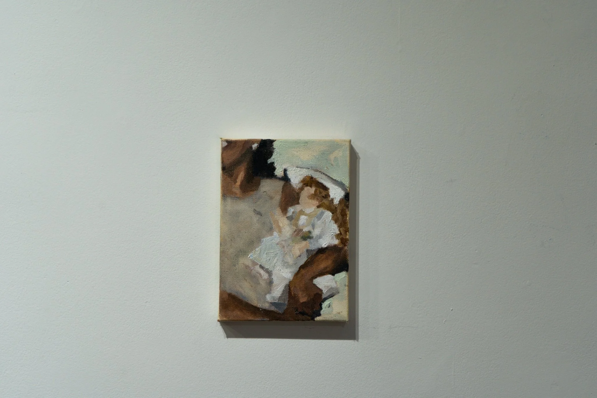 Abstract painting of a person with glasses, wearing a white shirt, and holding a dog.