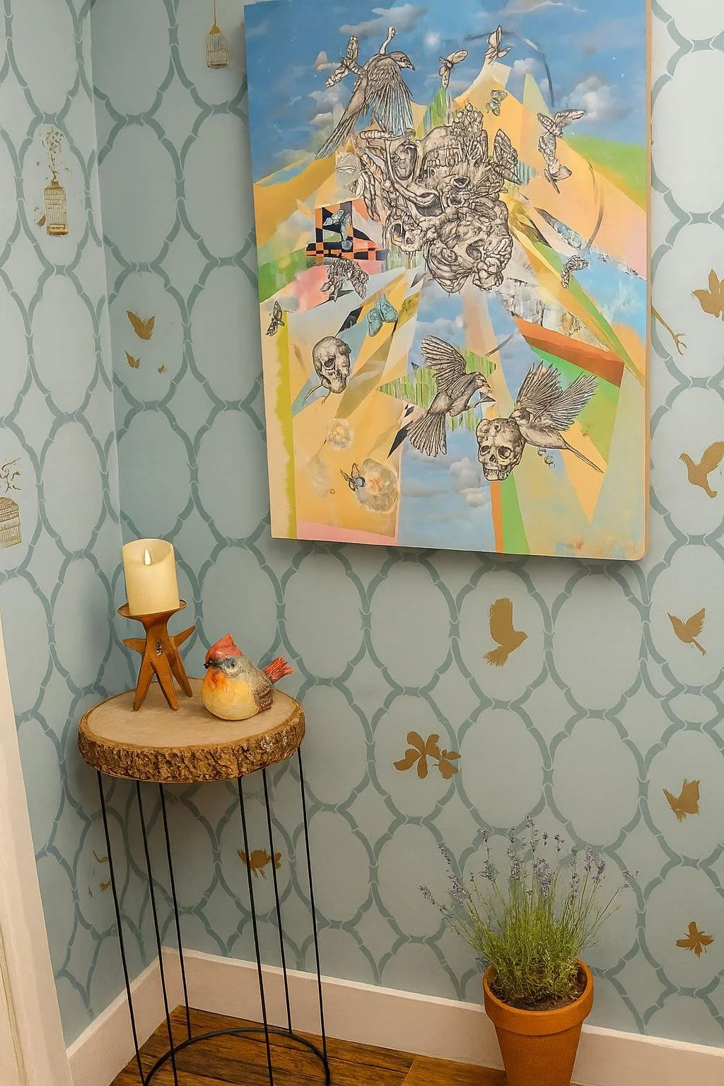 Hand-stenciled walls, with a bird motif in gold
