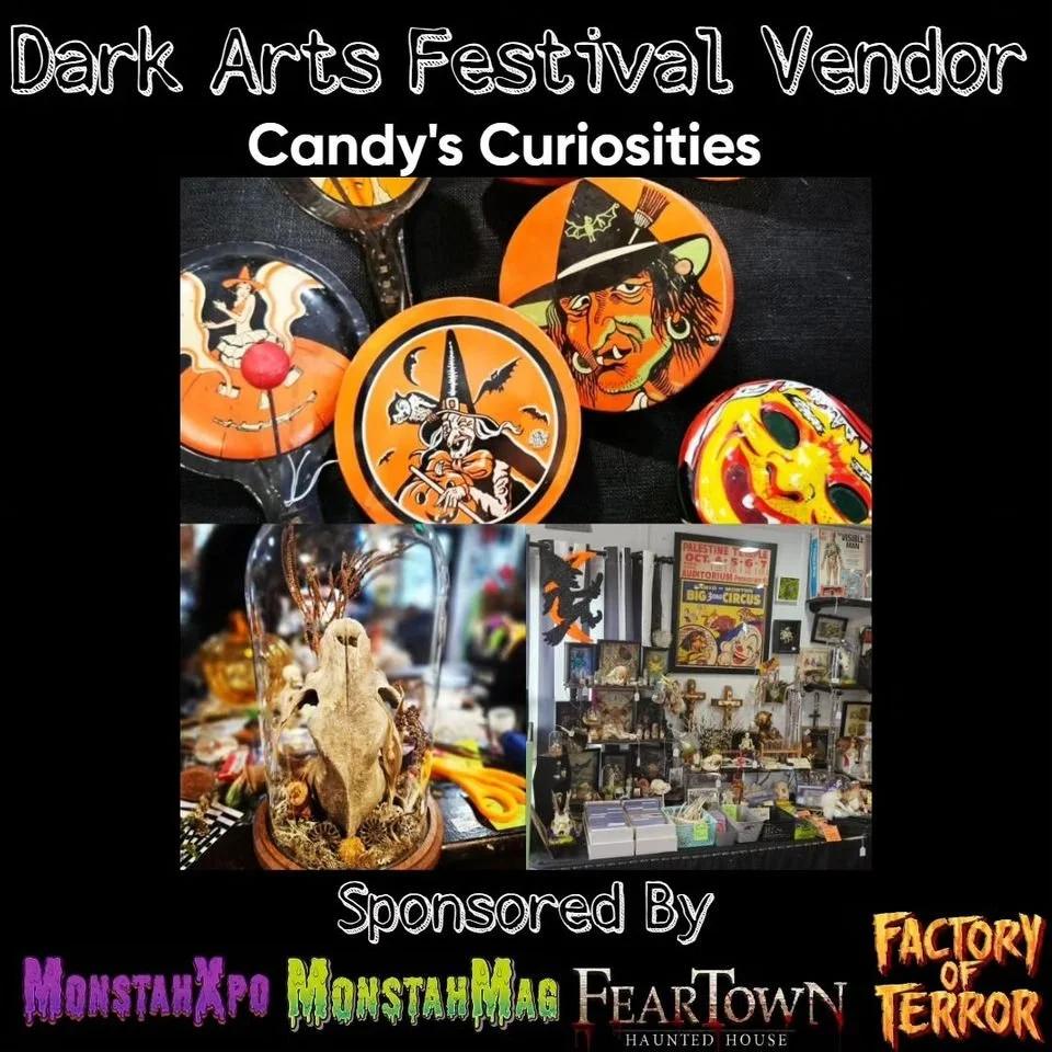 Image of Halloween-themed badges and a display of spooky artifacts at a dark arts festival vendor booth, titled 'Candy's Curiosities,' sponsored by MonstaXpo, MonstaMag, FearTOWN, Factory of Terror.