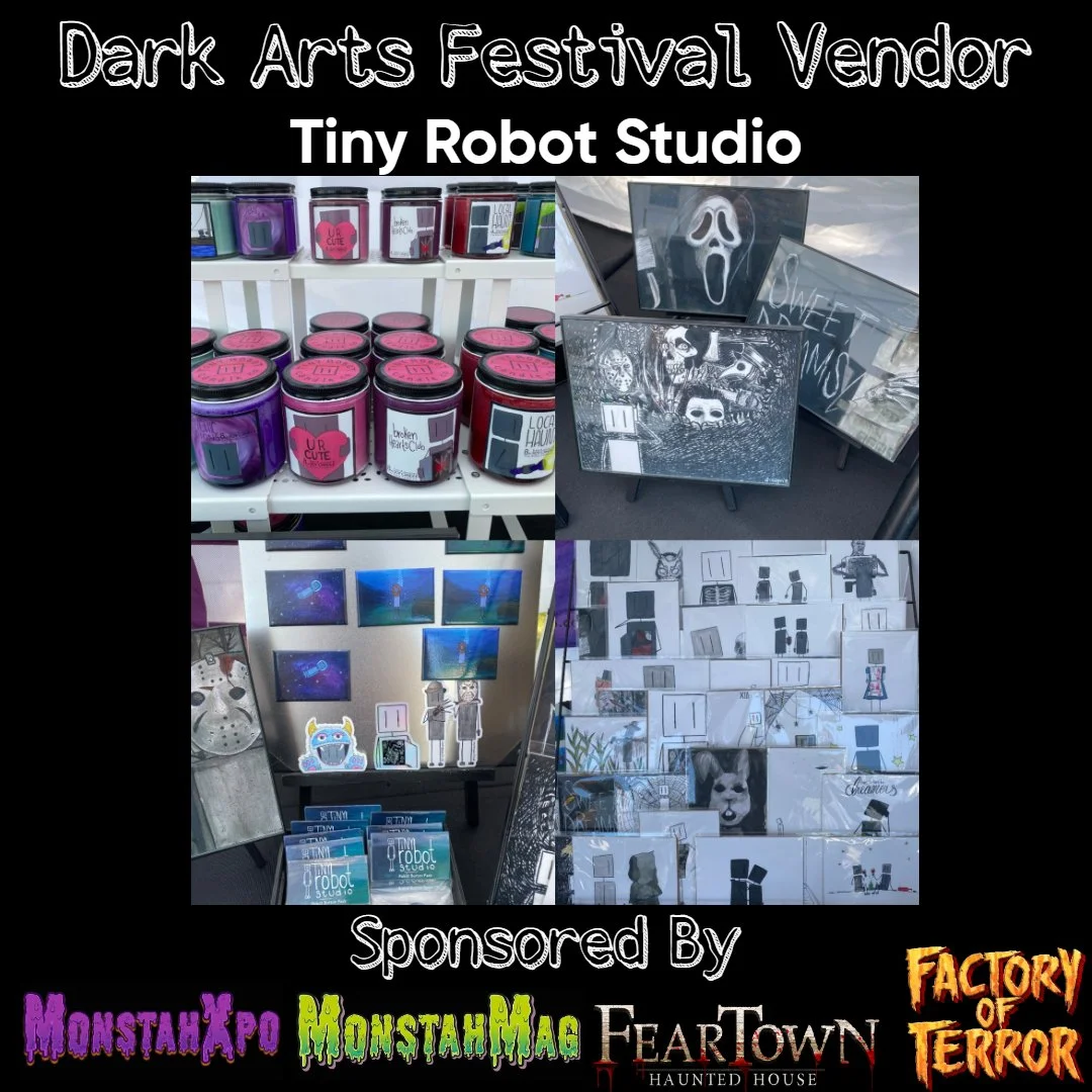 Display of themed merchandise at a Dark Arts Festival Vendor booth, featuring jars, artwork, and illustrated cards and signs.