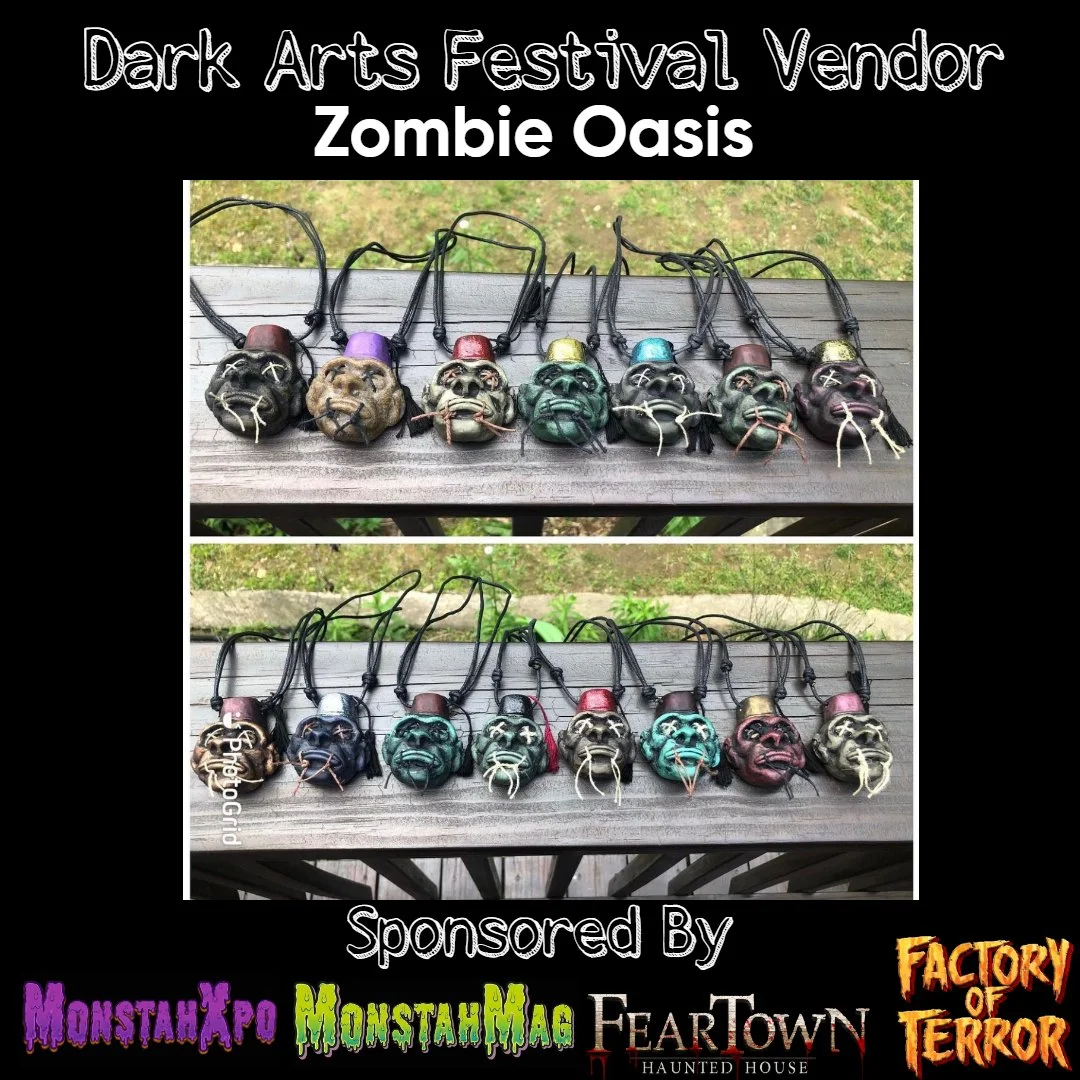 Display of zombie-themed necklaces with colorful skull pendants and strings, promoted as vendor items at Dark Arts Festival, sponsored by MonsterXpo, MonsterMag, Feartown Haunted House, and Factory of Terror.