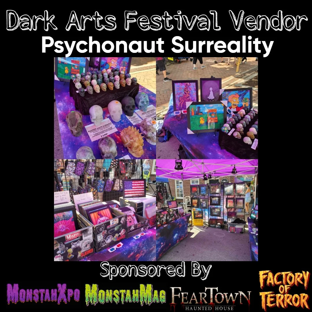 Display of horror-themed art and merchandise at the Dark Arts Festival, featuring skull sculptures, painted artworks, and various accessories, with sponsorship logos at the bottom.