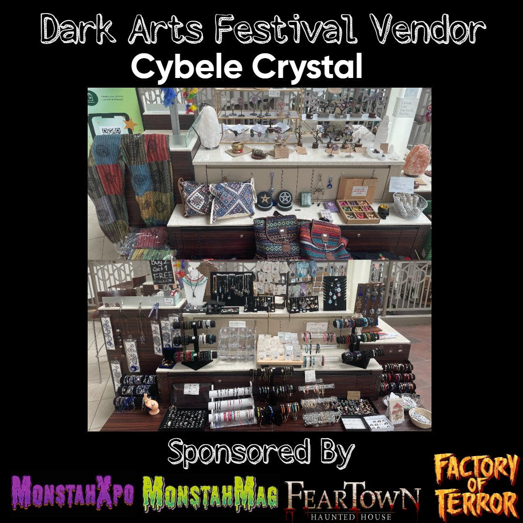 Photo of a vendor booth at Dark Arts Festival displaying jewelry, bags, and accessories, with various handcrafted items on tables and shelves.