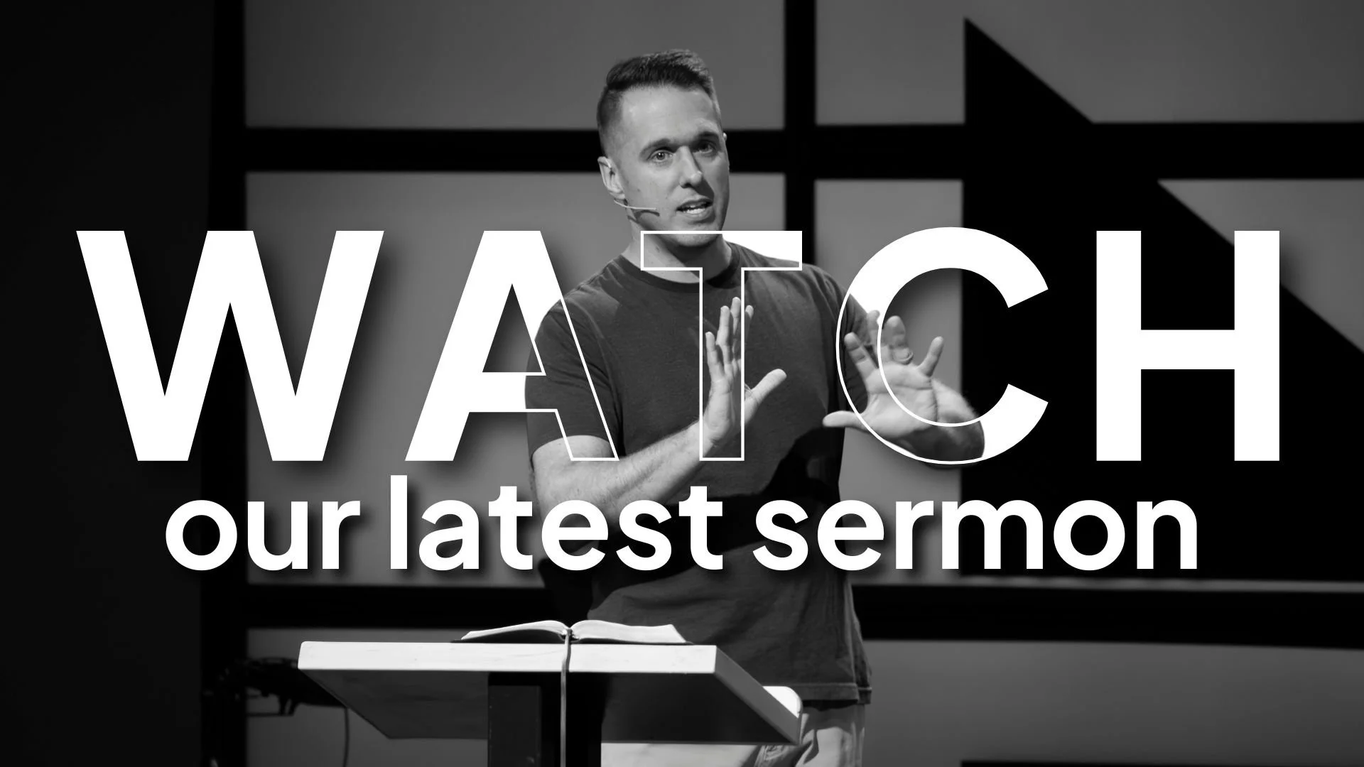 A black-and-white photo of a man speaking at a podium with a Bible, with the words "WATCH our latest sermon" overlaid on the image.