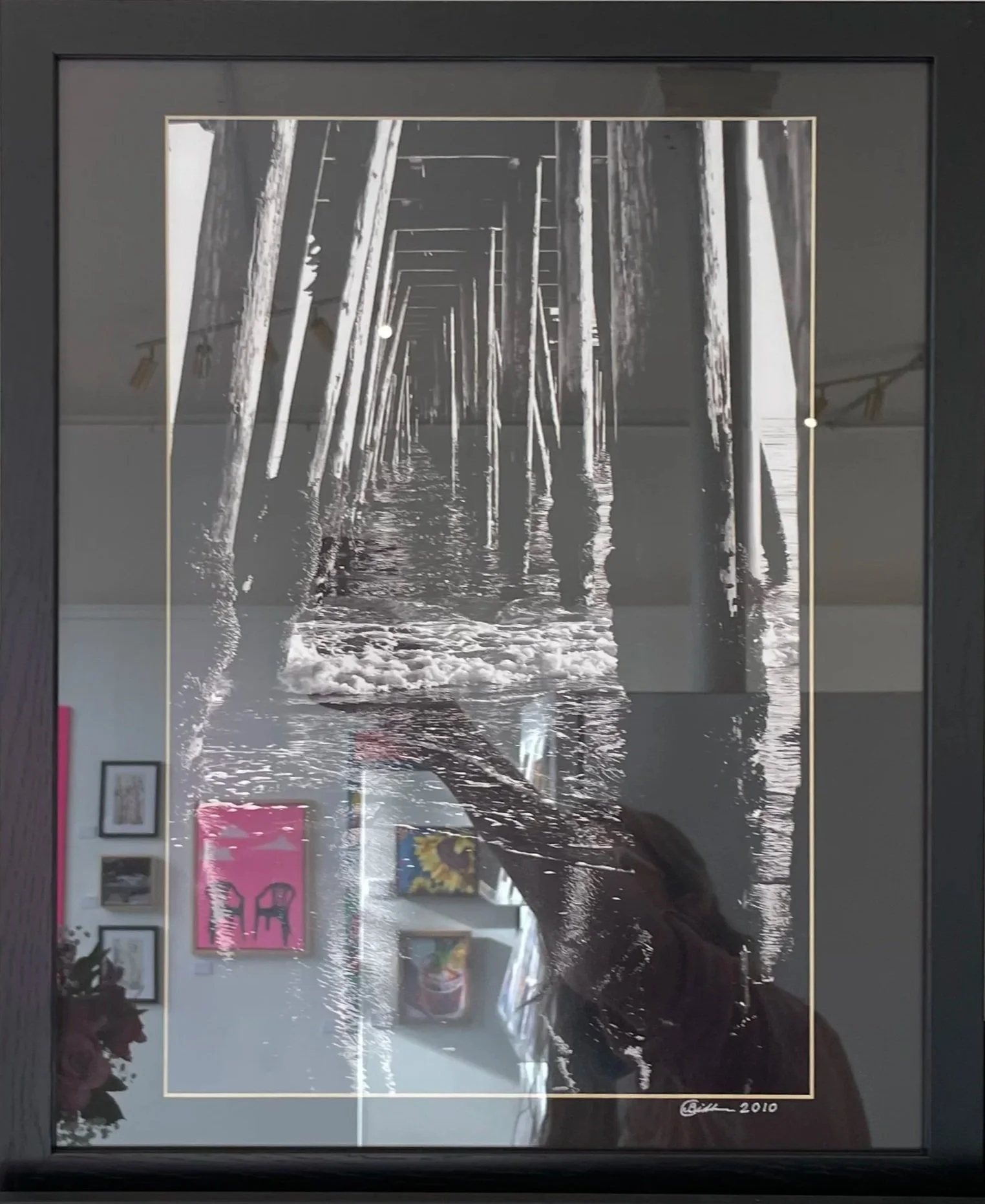 Pier Pilings In Gentle Waves by Chris Bidleman