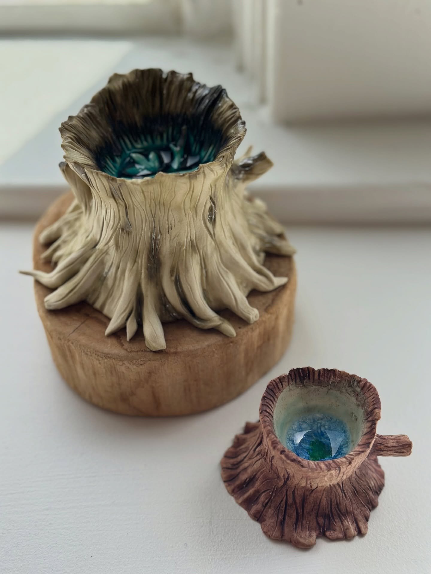 Ceramic tree stump sculptures with melted glass accents by Kaylin Rose 

Now on display