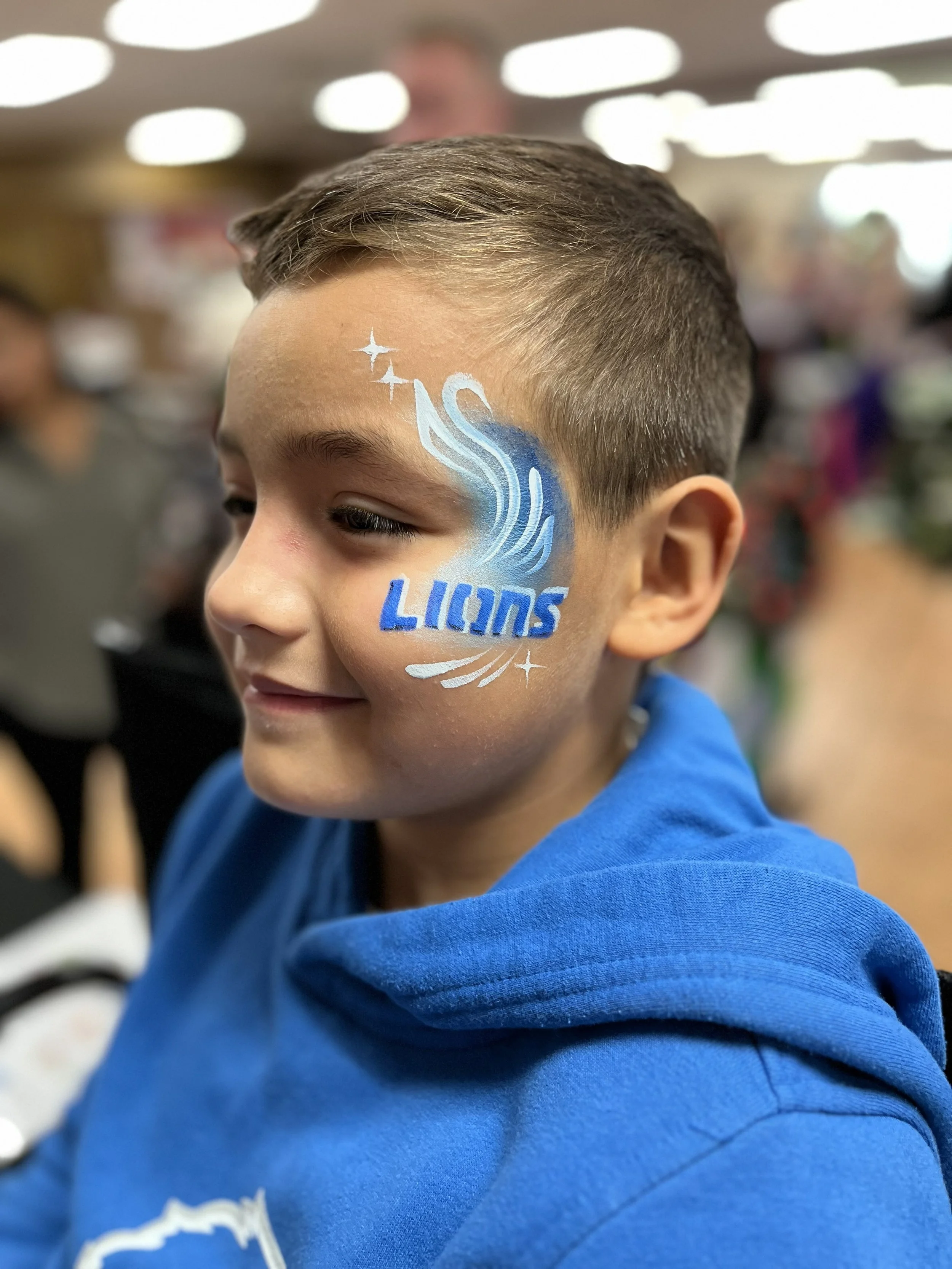 Detroit lions logo face painting blue and white