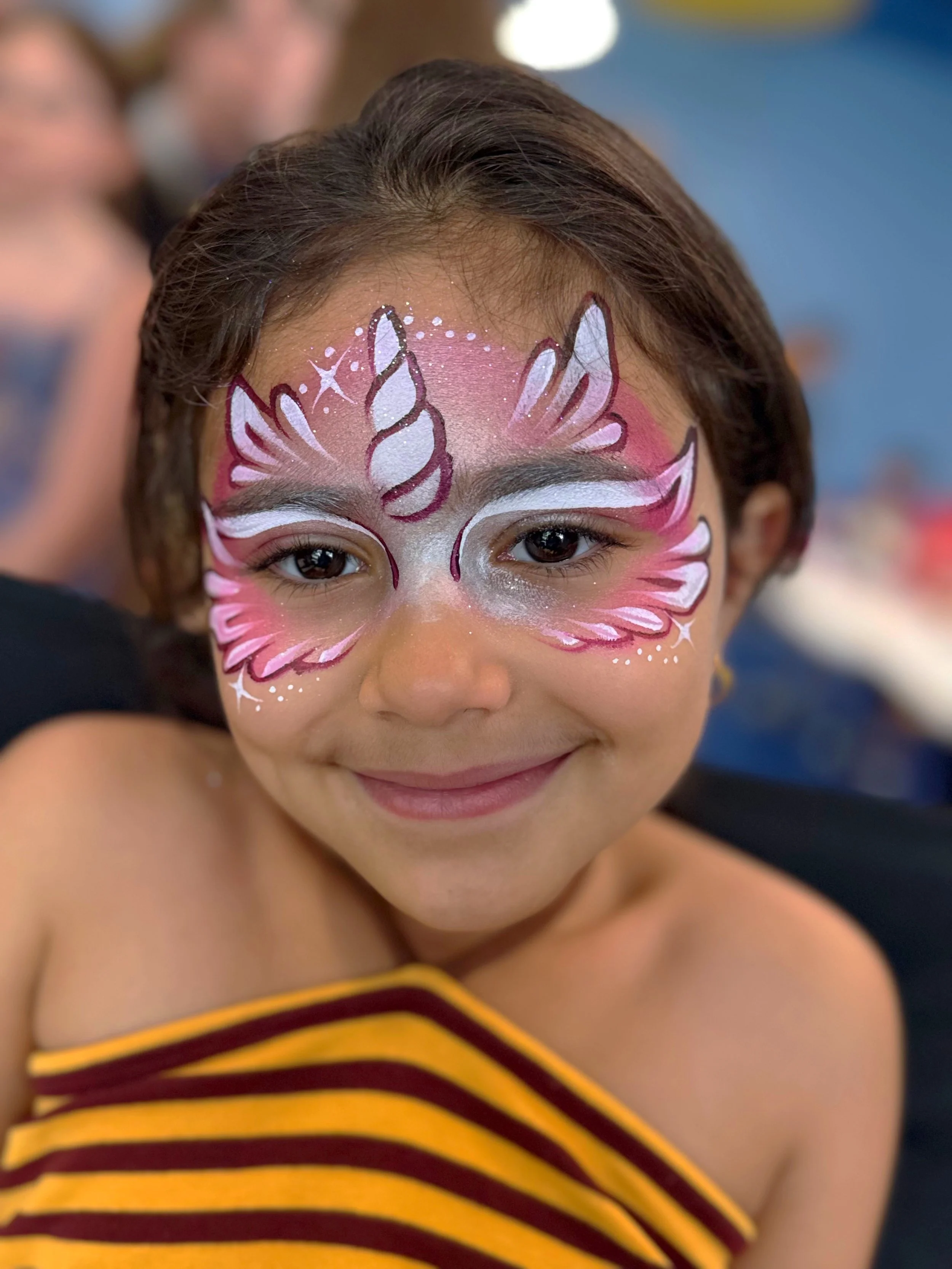 pink feather unicorn face paint design cute