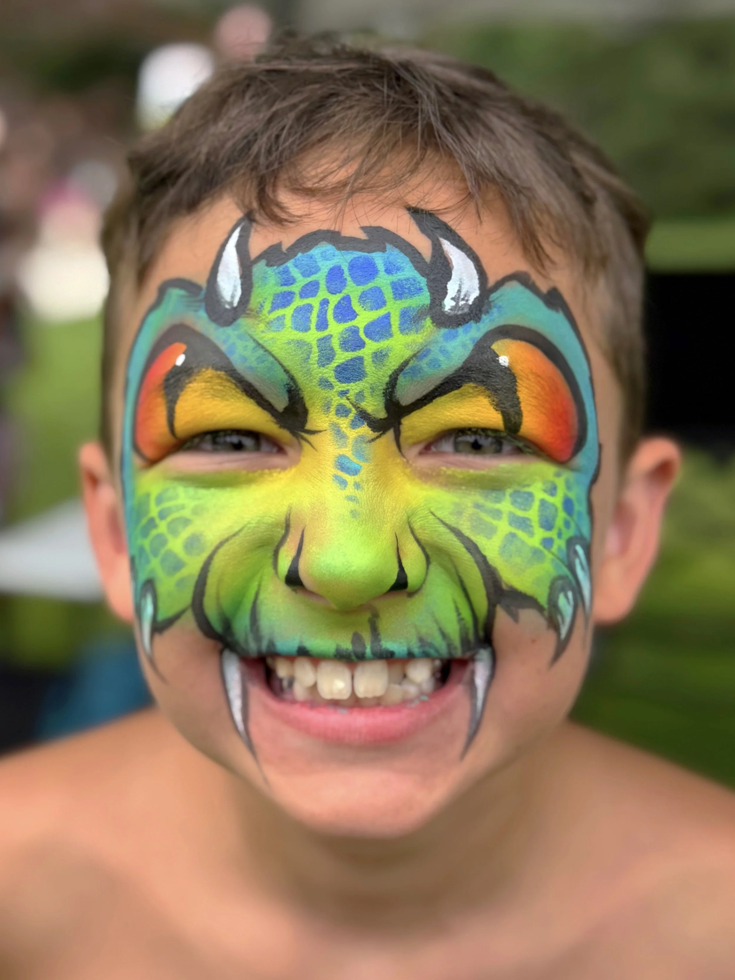 cute dragon face paint design for boys