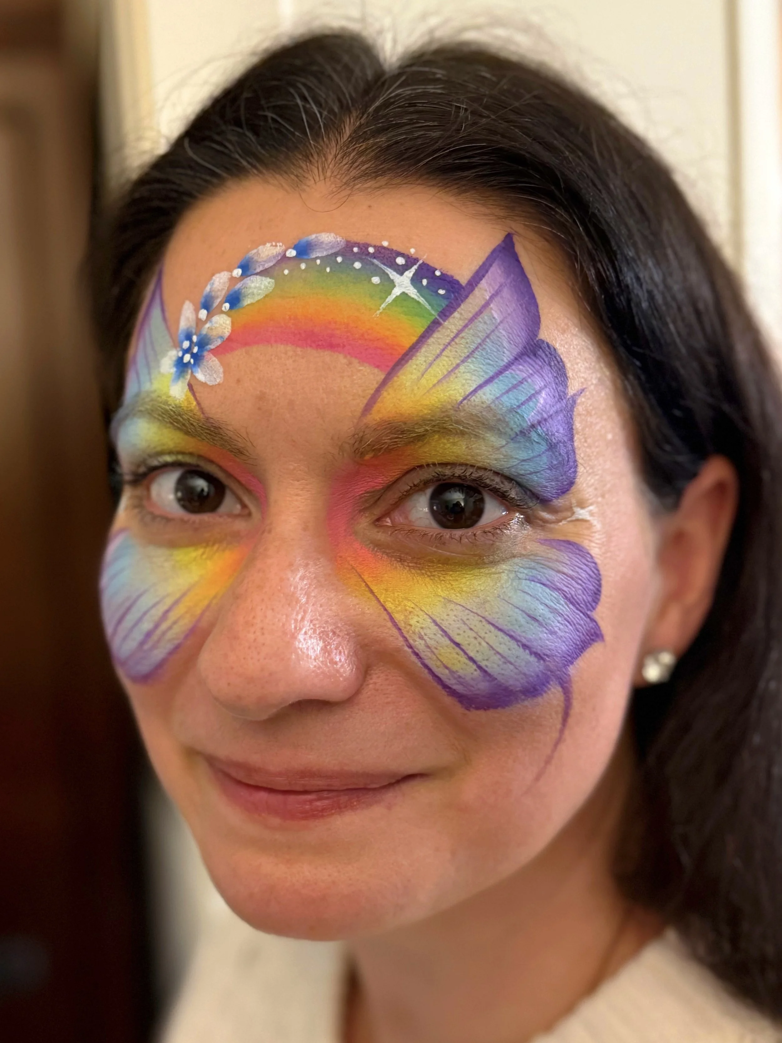 butterfly face painting rainbow and flowers
