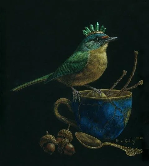 An emerald‑crowned green bird perches on the handle of a cracked Kintsugi teacup. Inside the cup rests a golden egg nestled among small twigs, while three acorns and a gold spoon sit nearby. The arrangement blends natural textures with refined detail
