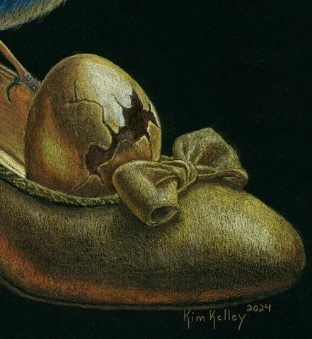 “Lower detail from ‘Symbolic Grace’ by Kim Kelley: cracked egg inside a golden shoe with a bow, with part of a bird’s leg and blue feathers entering the frame — colored pencil drawing.