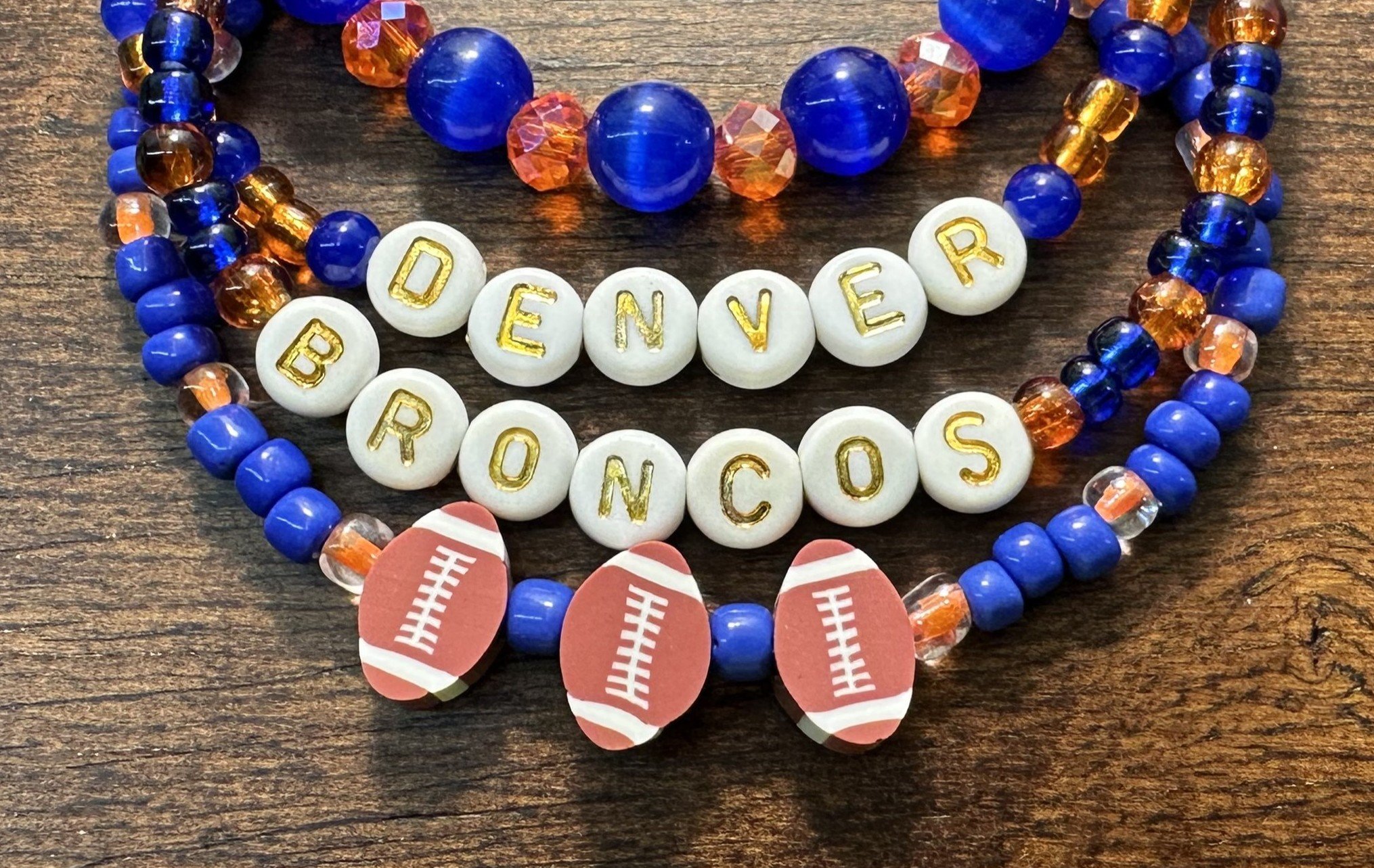 denver broncos bracelet on wood edit detail.jpg