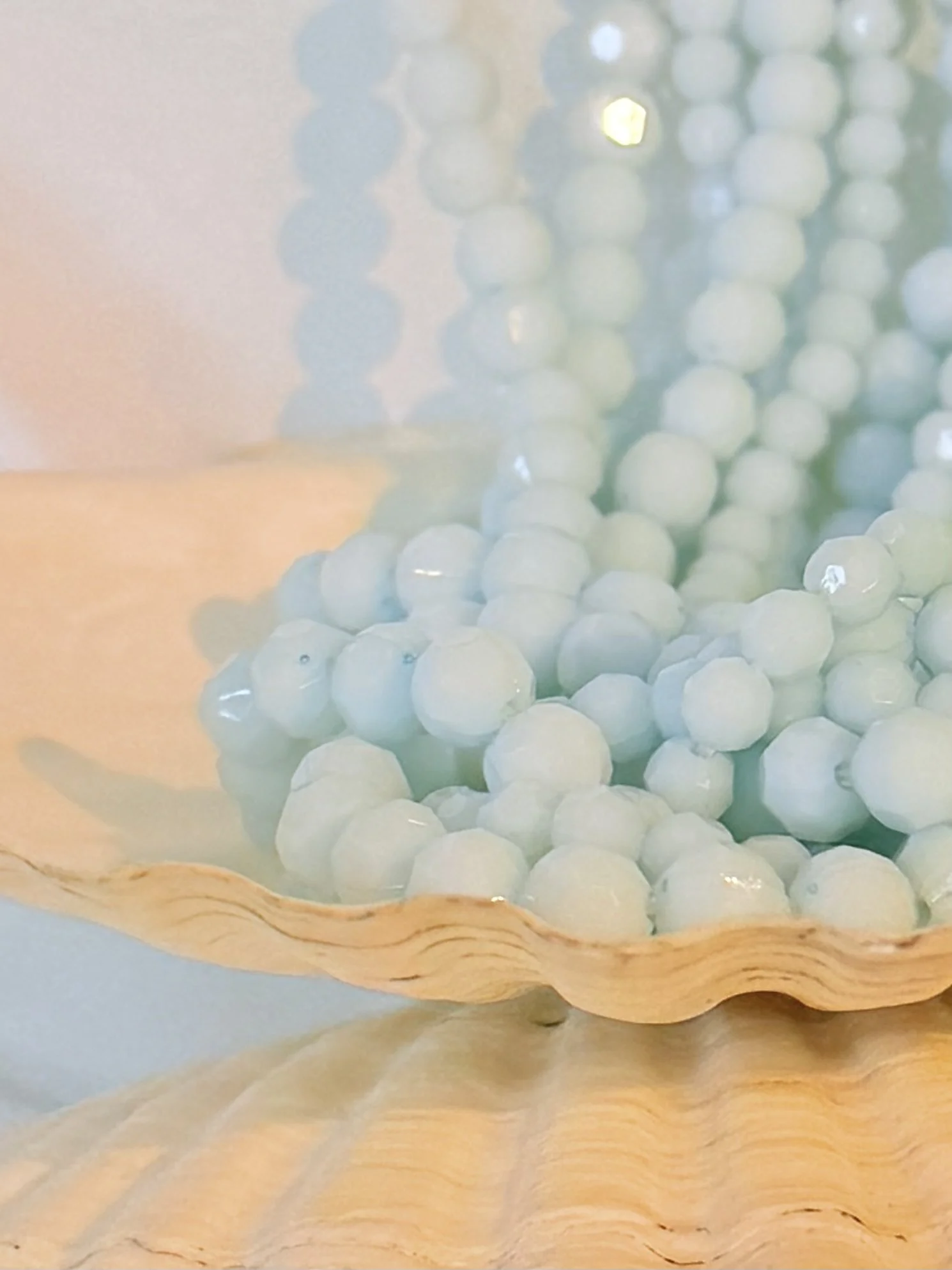 Blue multi strand beaded necklace worn as statement piece