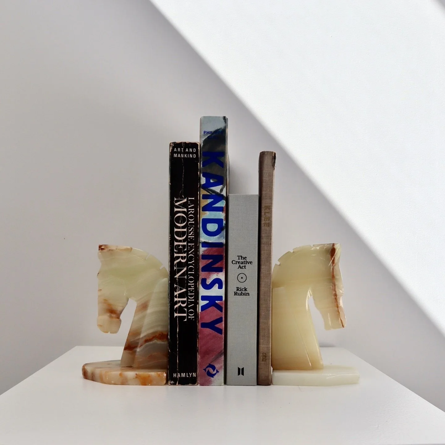 Giddy up.

The Horsepower Mexican Onyx bookends.
Your talisman for the #yearofthehorse 
Estimated c. late 1960s - 1970s.
Our hero piece for the first release. 
SOLD before live, to a collector with a keen eye.

Turn your shelf into a shrine with thes